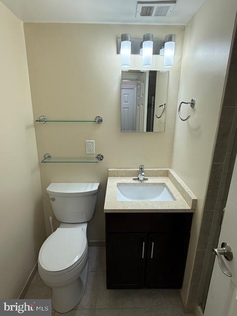 3822 Bel Pre Road, Unit 38223 Silver Spring, MD 20906 - Photo 29 of 31 a bathroom with a sink toilet and mirror