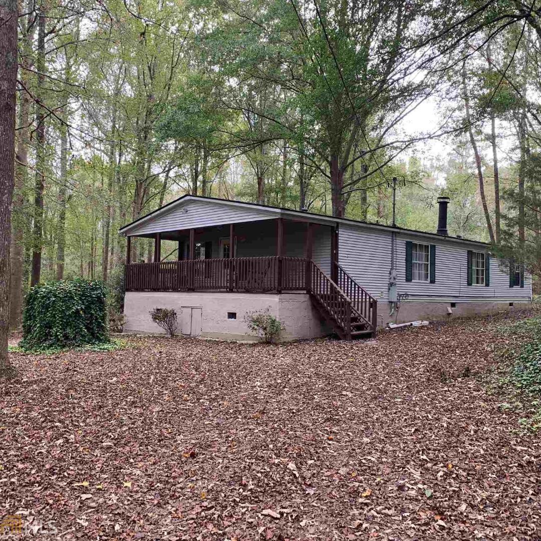 1181 Adcock Road Monroe, GA 30655 - Photo 1 of 1 a view of a house with a yard and sitting area