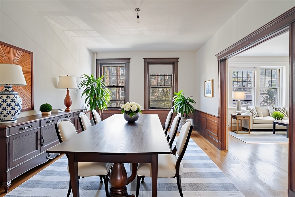 12 Gibbs Street, Unit 2 Brookline, MA 02446 - Photo 4 of 21 a view of a dining room with furniture and wooden floor