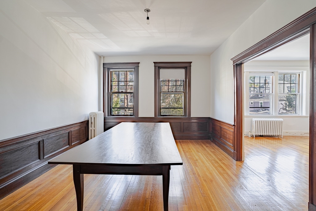 12 Gibbs Street, Unit 2 Brookline, MA 02446 - Photo 5 of 21 a view of a dining room with furniture and wooden floor