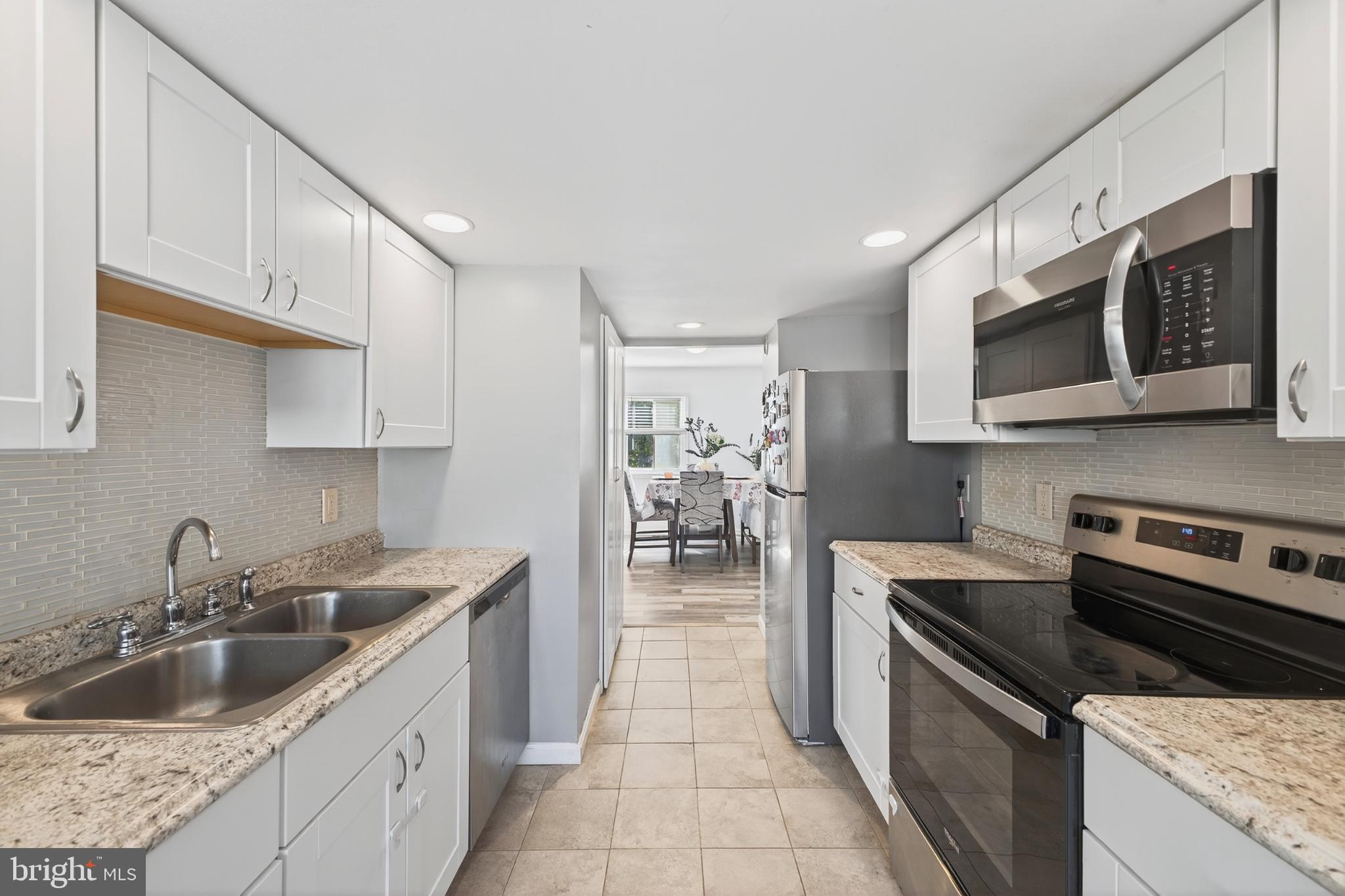 12462 Skipper Circle Woodbridge, VA 22192 - Photo 5 of 25 Modern kitchen with sleek finishes.