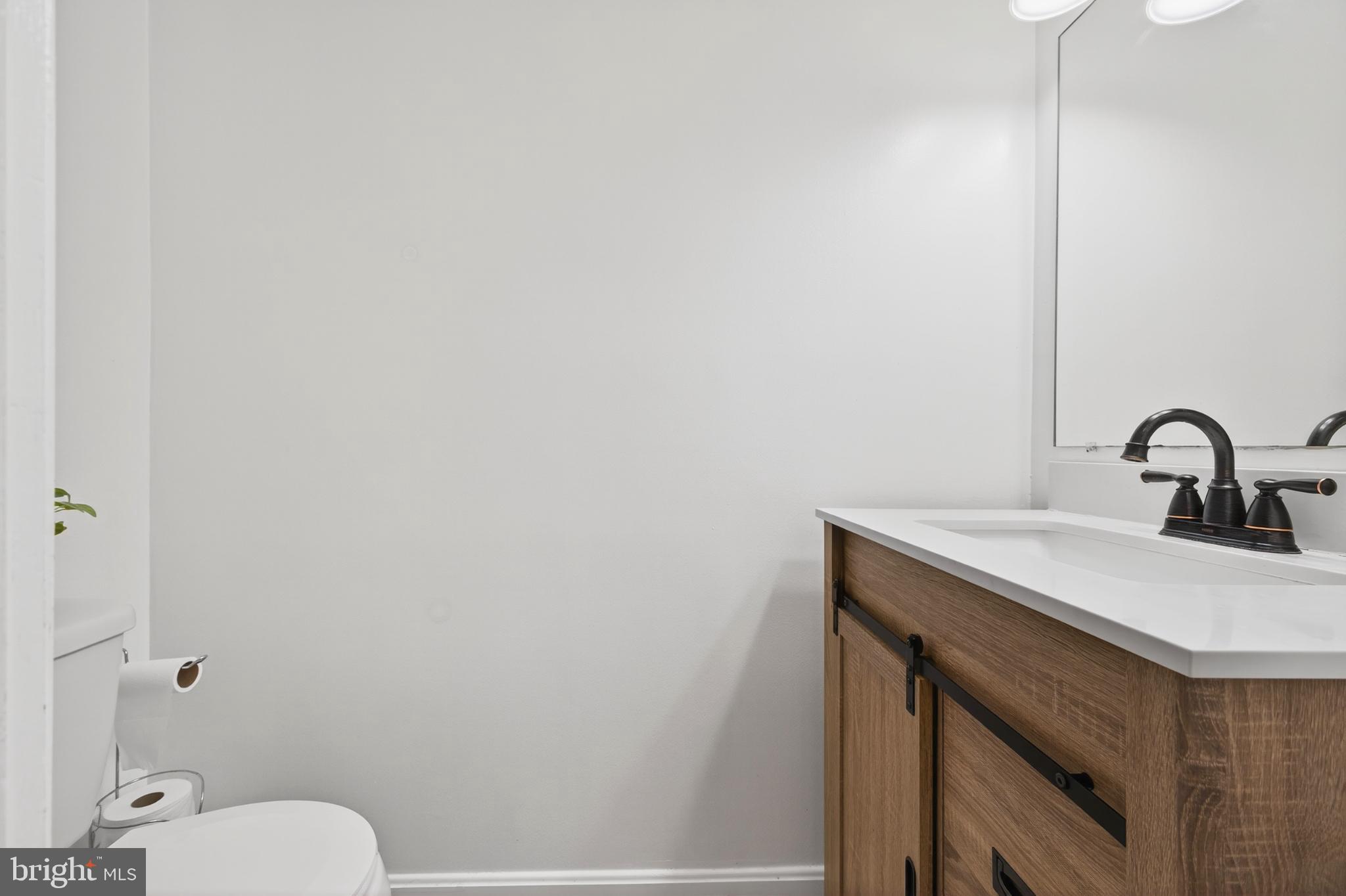 12462 Skipper Circle Woodbridge, VA 22192 - Photo 9 of 25 Sleek modern bathroom with natural tones.
