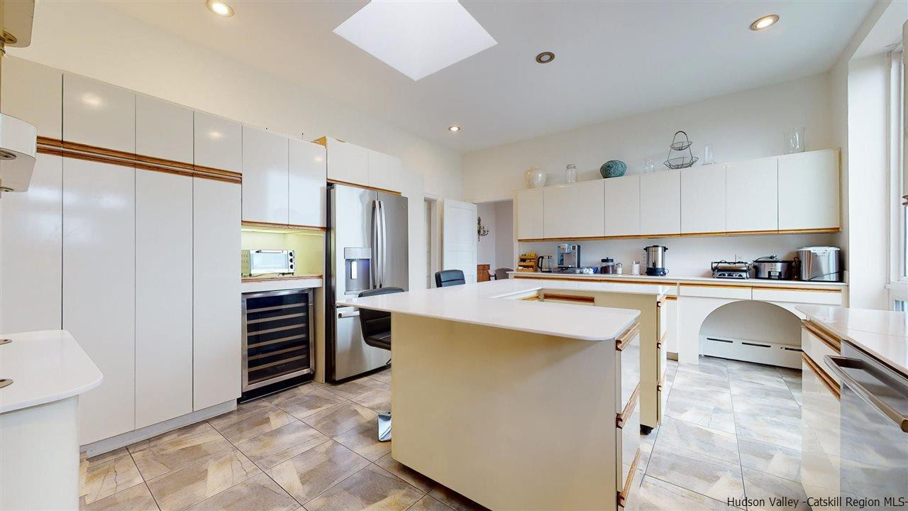 27 Westview Drive Wallkill, NY 12589 - Photo 14 of 35 a kitchen with refrigerator and cabinets