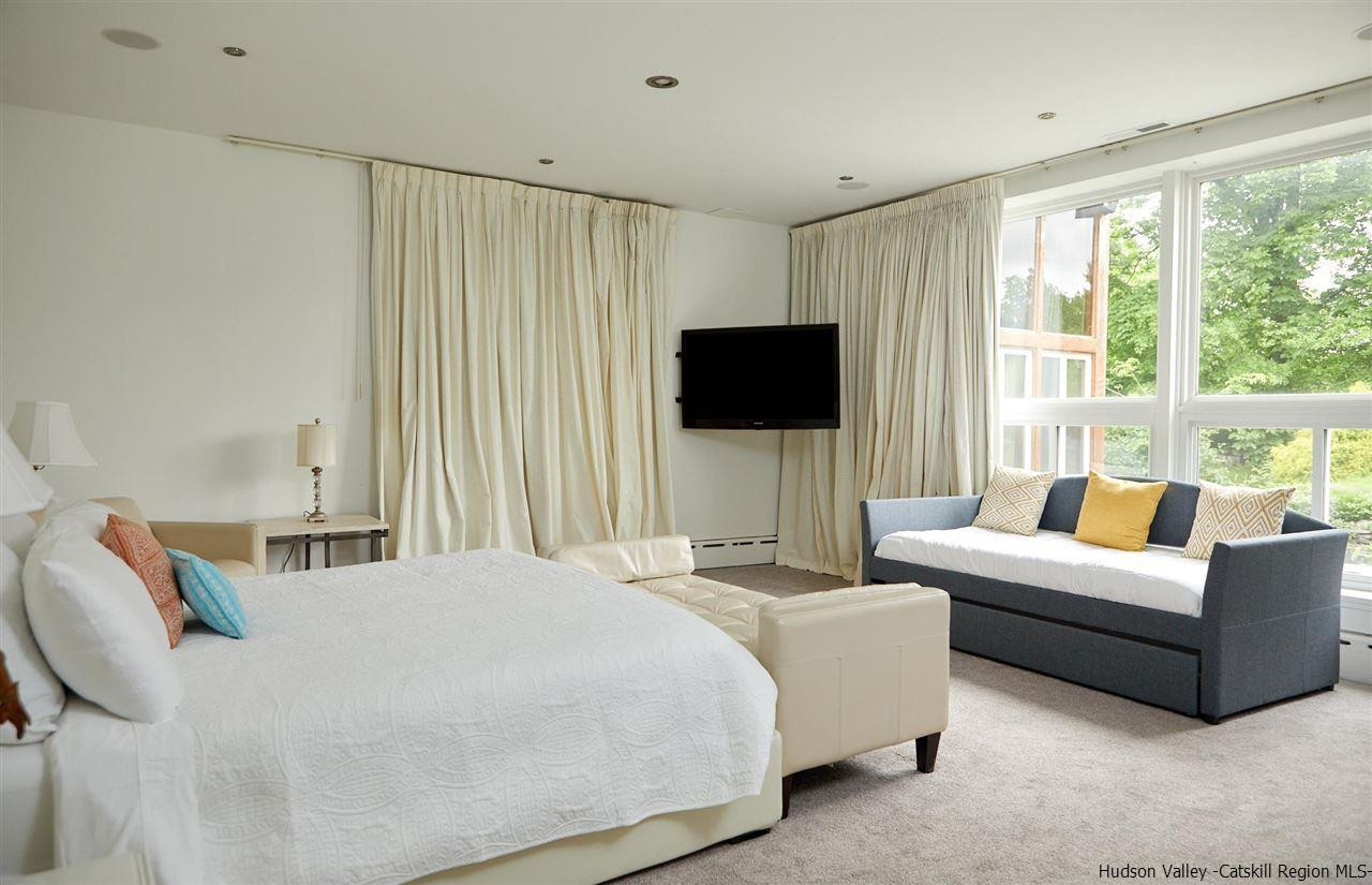 27 Westview Drive Wallkill, NY 12589 - Photo 15 of 35 a bedroom with a bed and a flat screen tv