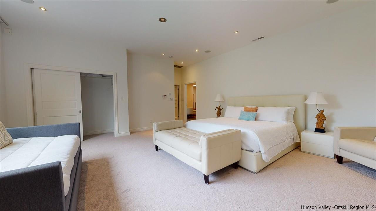 27 Westview Drive Wallkill, NY 12589 - Photo 16 of 35 a spacious bedroom with a bed and a couch