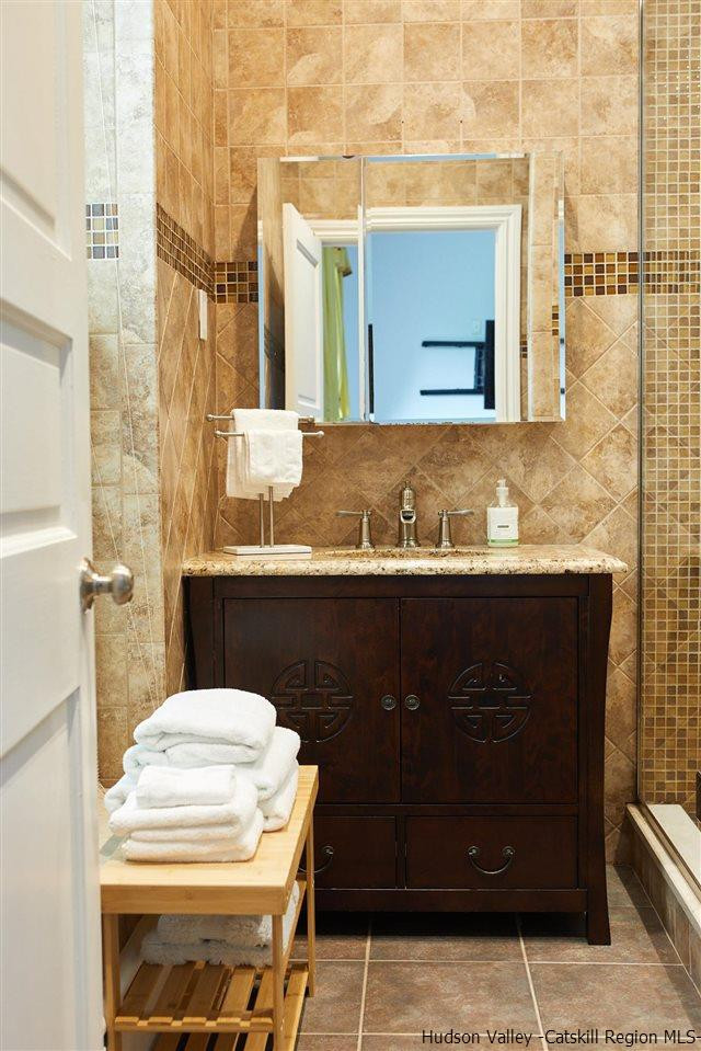 27 Westview Drive Wallkill, NY 12589 - Photo 21 of 35 a bathroom with a sink and a mirror