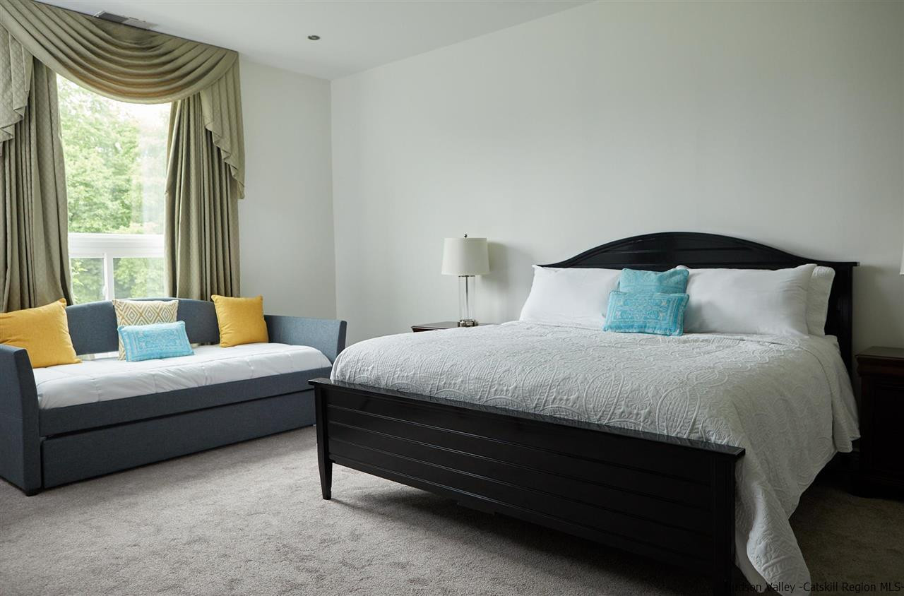 27 Westview Drive Wallkill, NY 12589 - Photo 23 of 35 a bedroom with bed and a large window