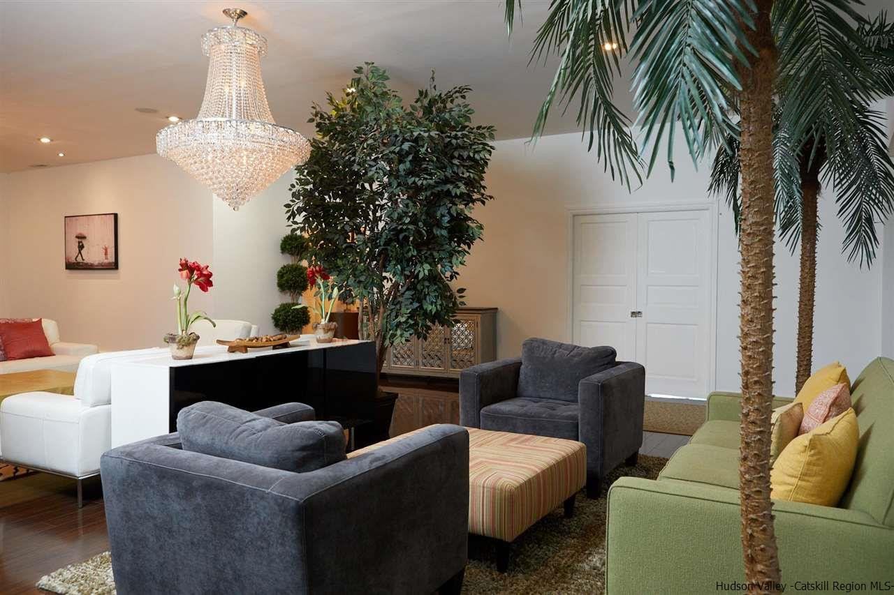 27 Westview Drive Wallkill, NY 12589 - Photo 6 of 35 a living room with furniture and a chandelier