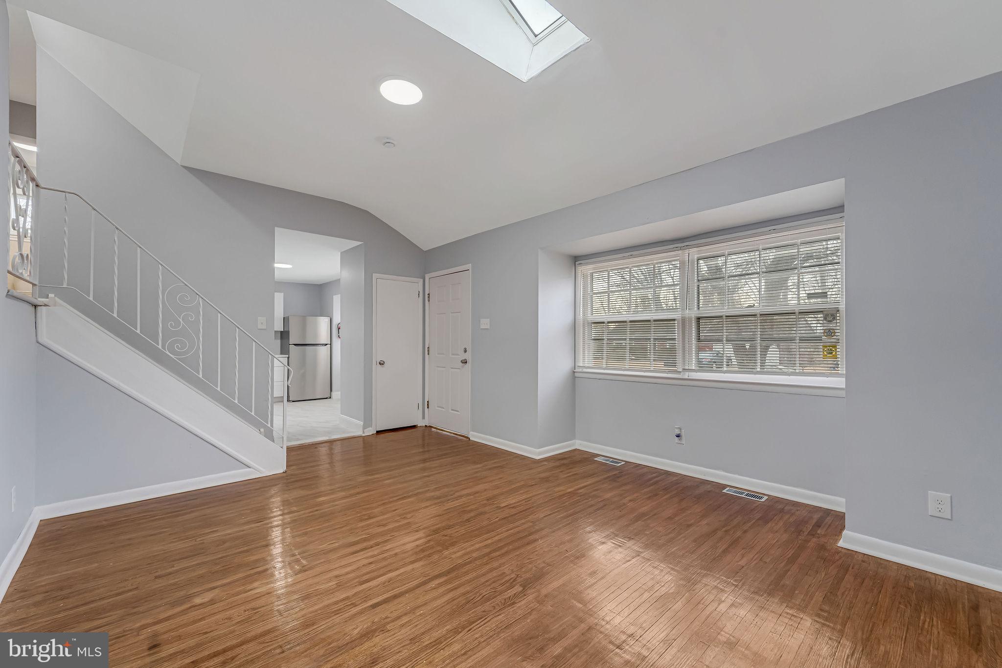 2405 North Cuthbert Drive Lindenwold, NJ 08021 - Photo 4 of 31 a view of an empty room with wooden floor and a window