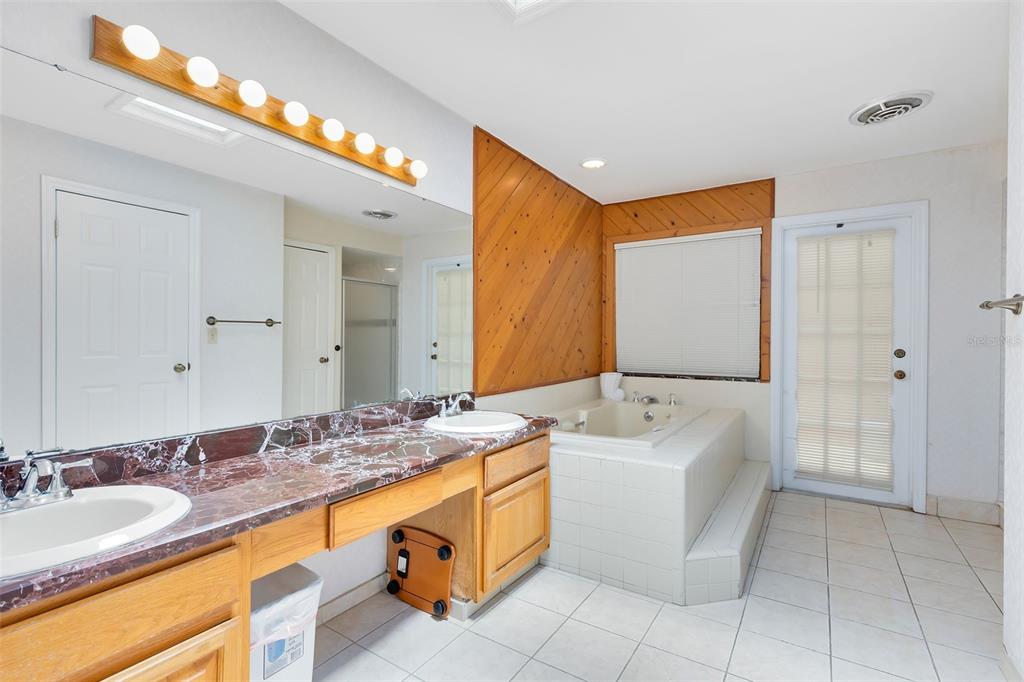 111 Variety Tree Circle Altamonte Springs, FL 32714 - Photo 17 of 35 An equally spacious ensuite bath includes two additional closets, dual sinks, a luxurious garden tub, and a shower.