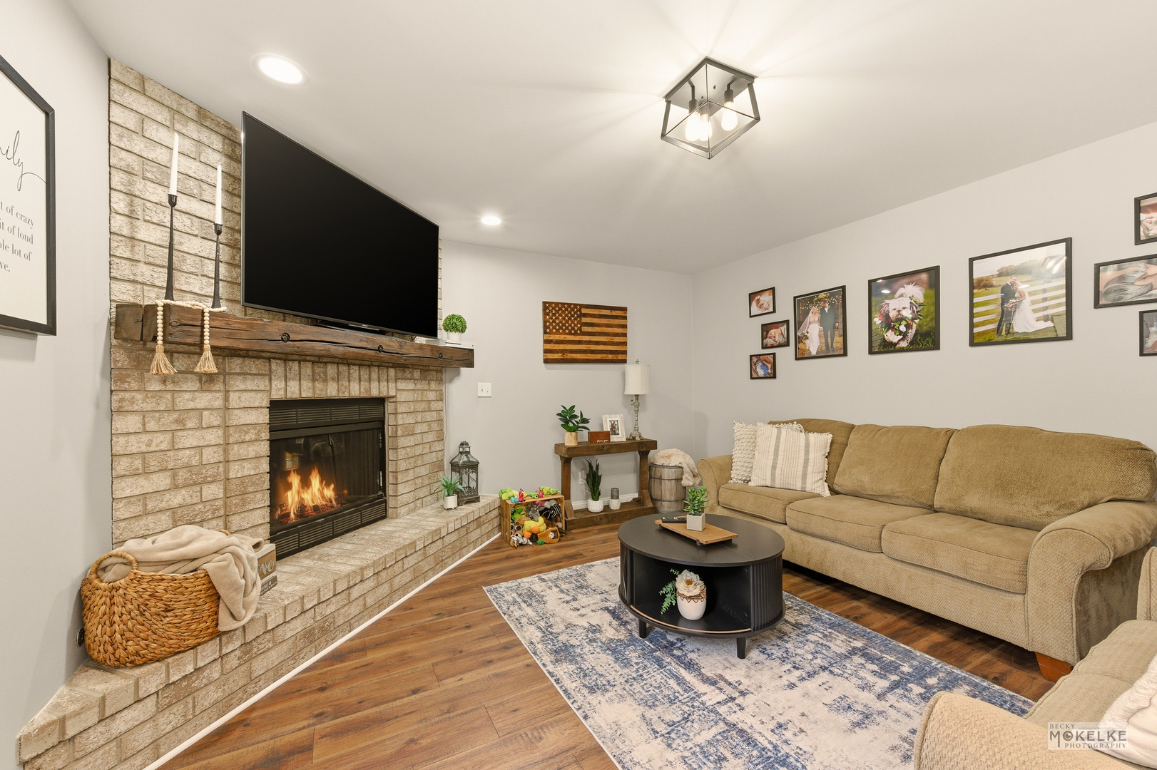 777 Debbie Lane Sandwich, IL 60548 - Photo 13 of 39 a living room with furniture a flat screen tv and a fireplace