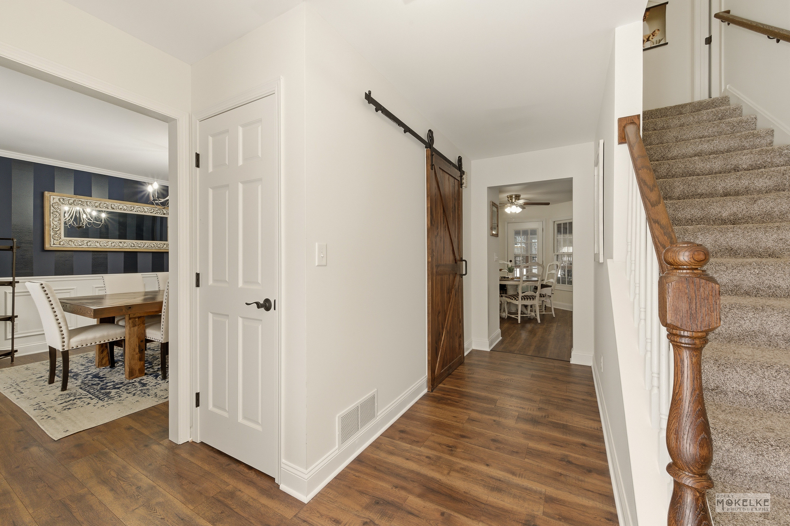 777 Debbie Lane Sandwich, IL 60548 - Photo 5 of 39 a view of a hallway with wooden floor and staircase