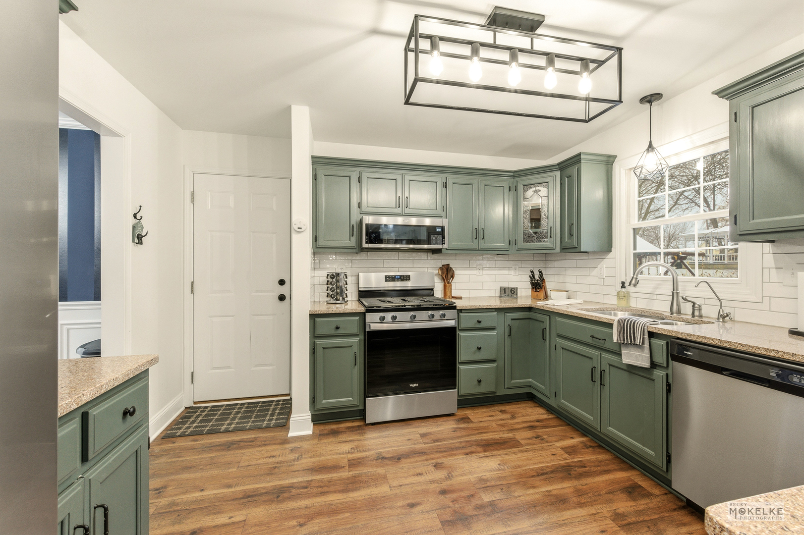 777 Debbie Lane Sandwich, IL 60548 - Photo 9 of 39 a kitchen with stainless steel appliances granite countertop a sink and stove top oven