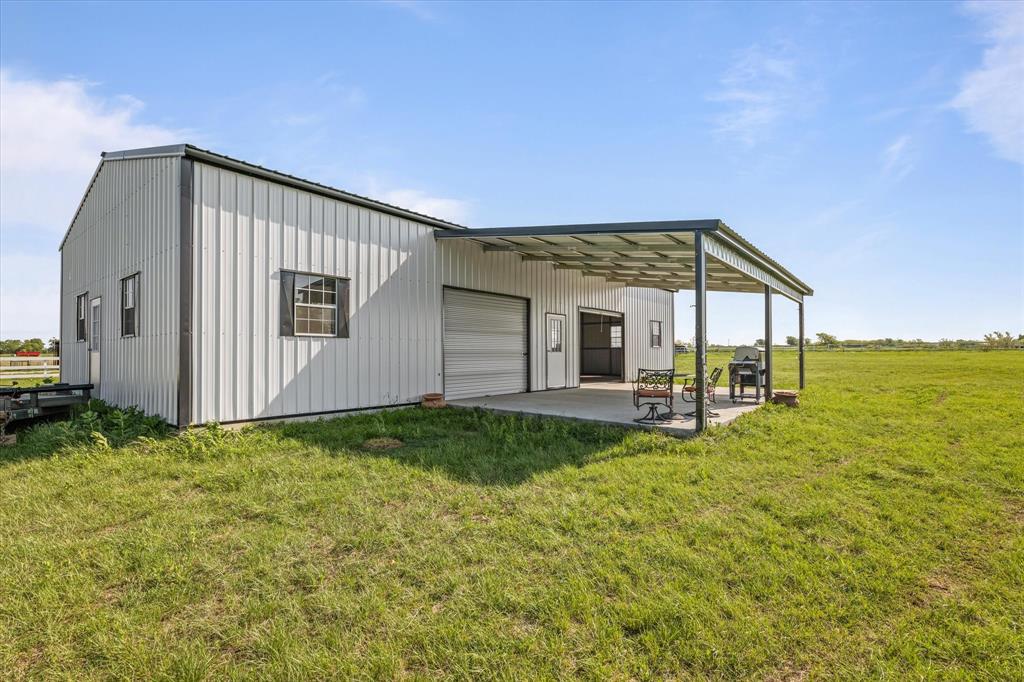 25 Cr 235 Valley View Valley View, TX 76272 - Photo 2 of 23 a view of a house with backyard porch and garden