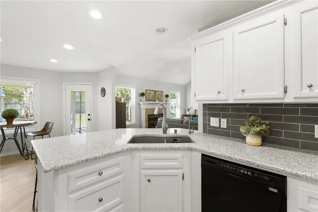 a kitchen with sink and cabinets