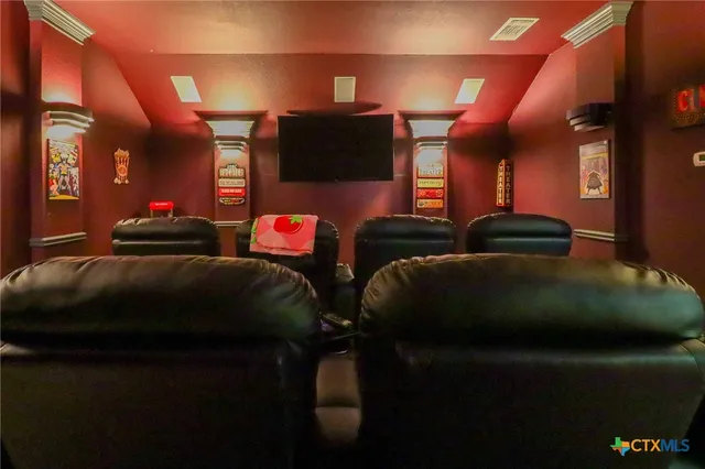 a living room with furniture and a gym equipment