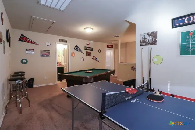 a front view of house with yard and outdoor seating