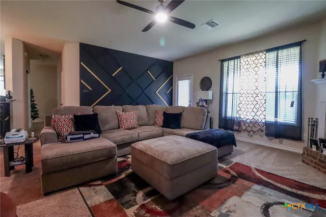 a dining room with furniture and window