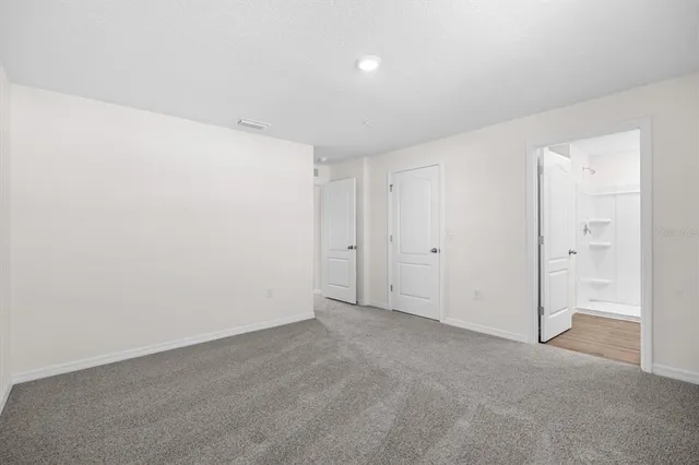 a bathroom with a granite countertop sink mirror and double