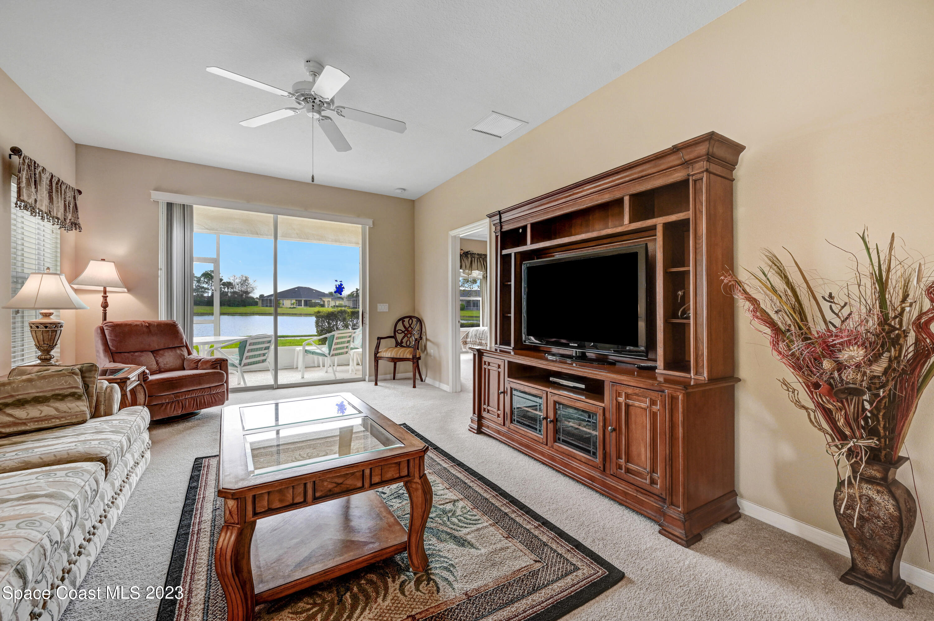 3341 Funston Circle Melbourne, FL 32940 - Photo 11 of 61 a living room with furniture and a flat screen tv
