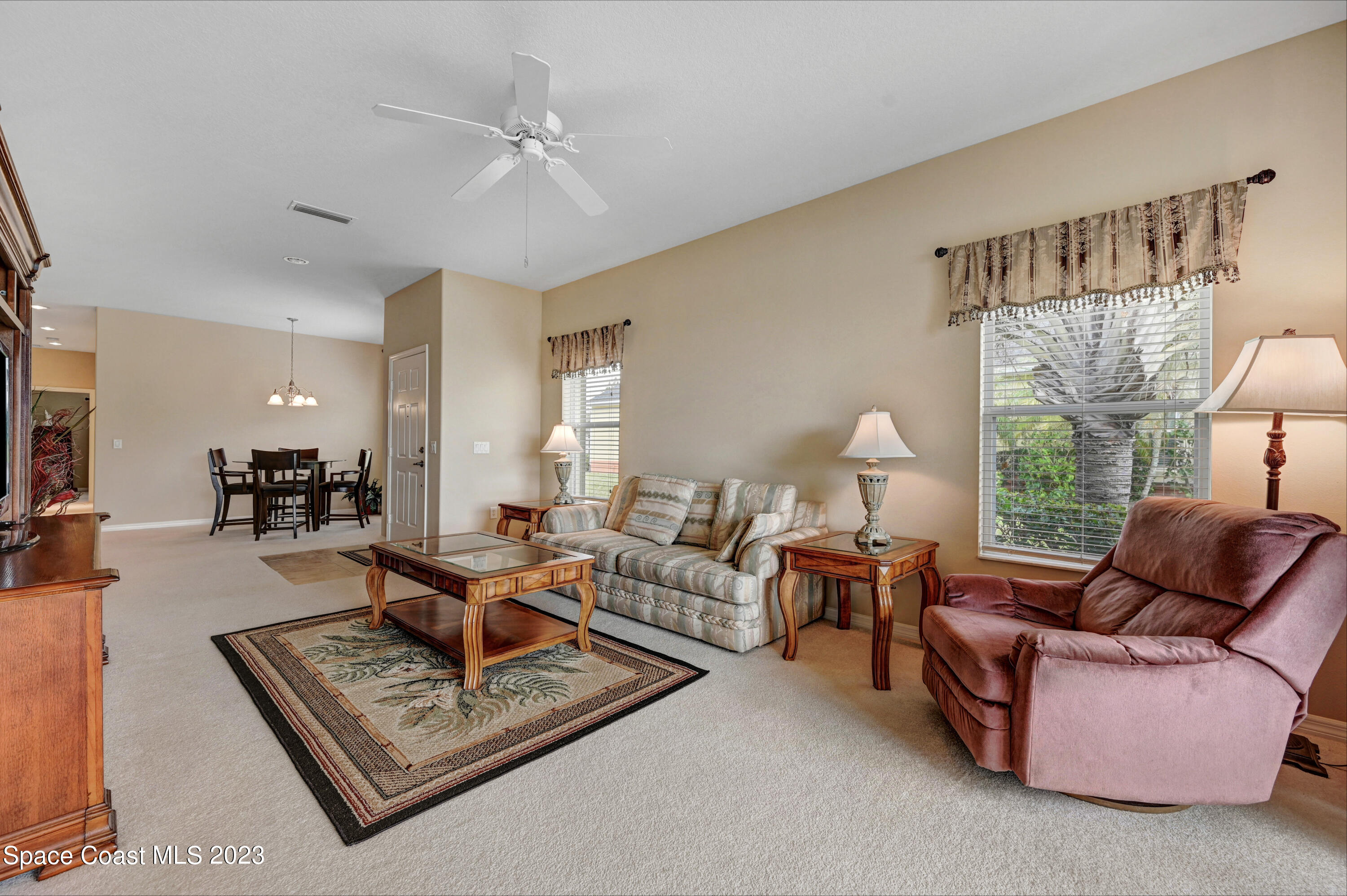 3341 Funston Circle Melbourne, FL 32940 - Photo 13 of 61 a living room with furniture and a large window