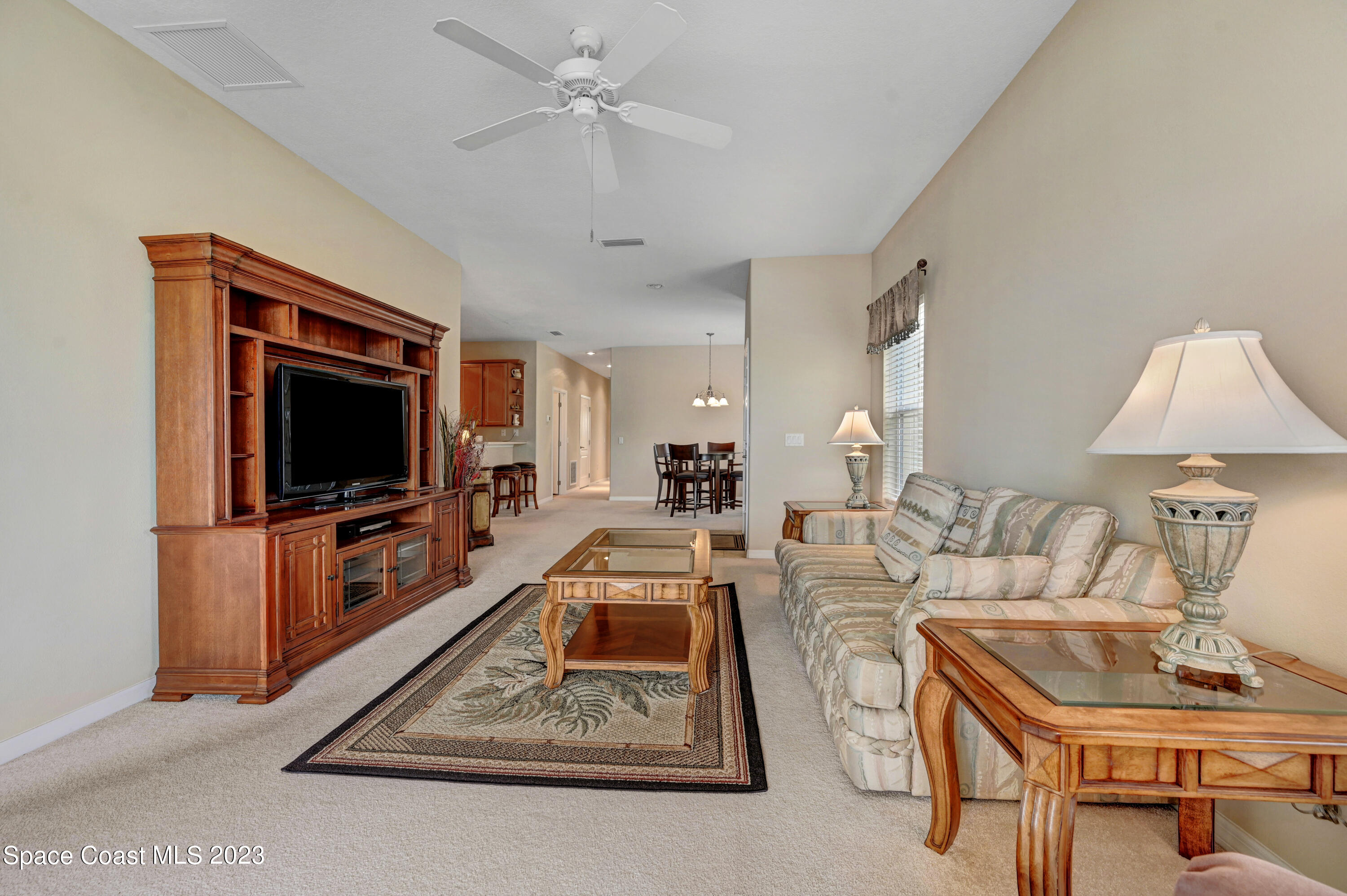 3341 Funston Circle Melbourne, FL 32940 - Photo 14 of 61 a living room with furniture and a flat screen tv