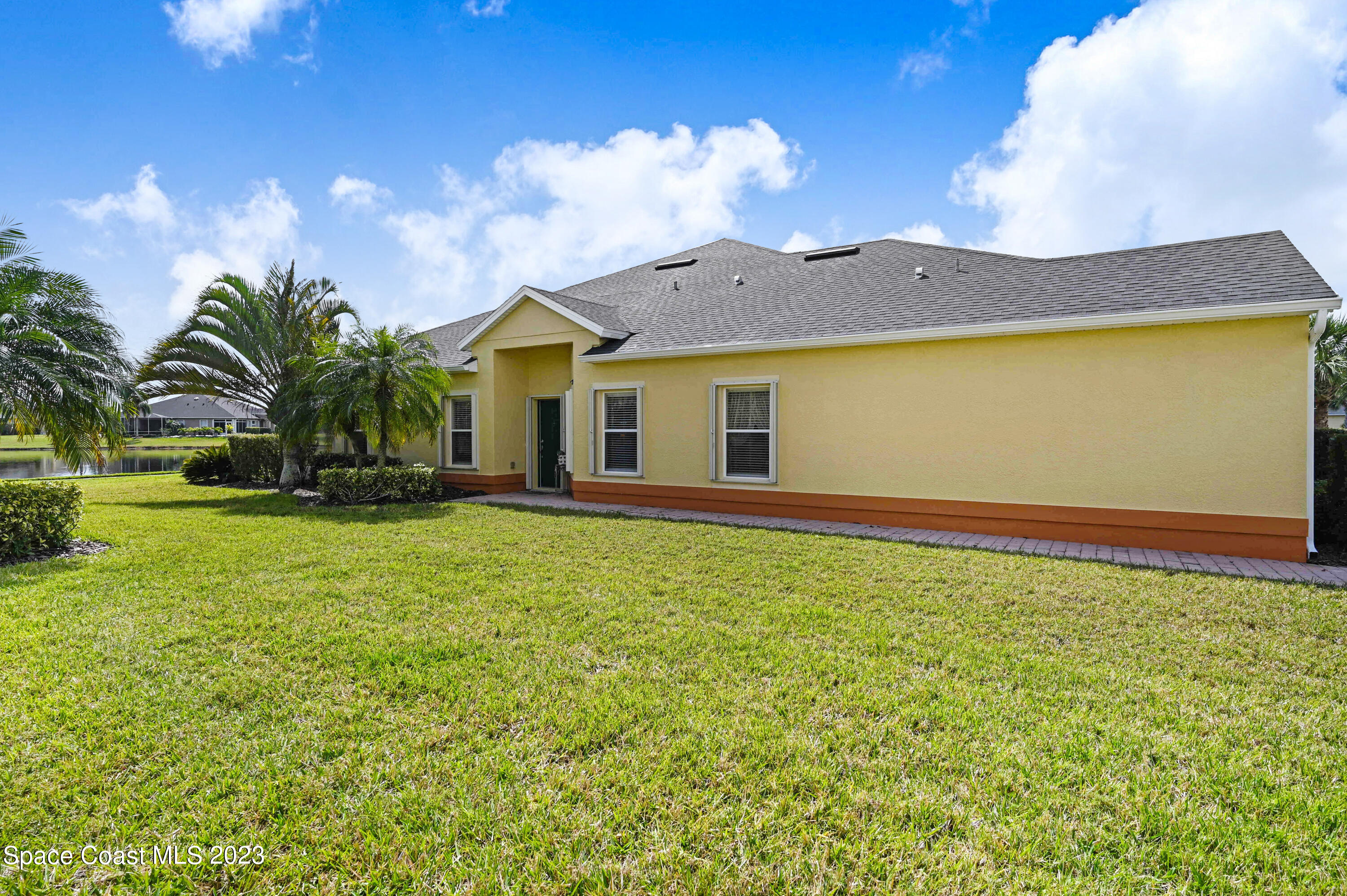 3341 Funston Circle Melbourne, FL 32940 - Photo 2 of 61 a view of a house with a yard