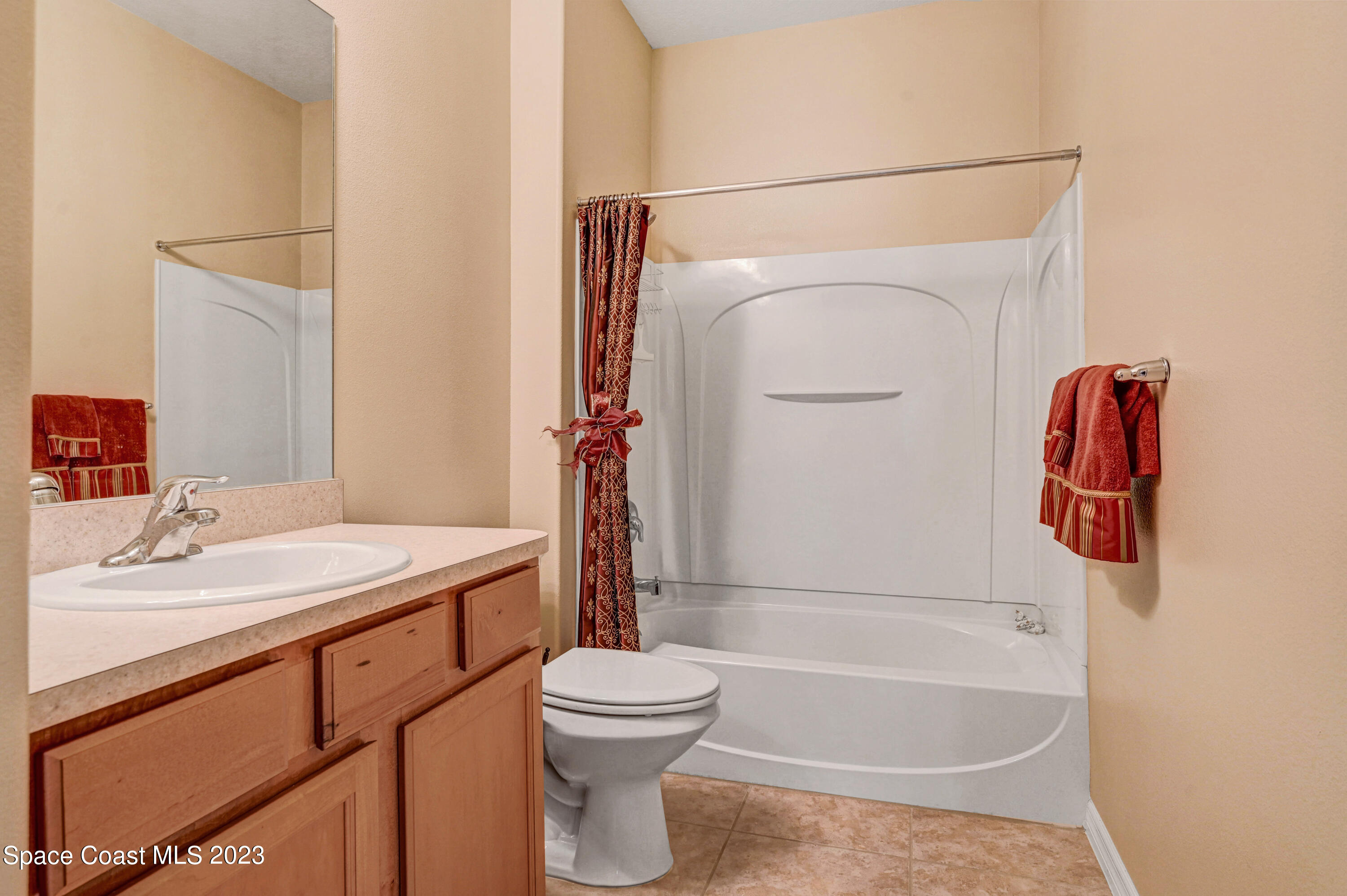 3341 Funston Circle Melbourne, FL 32940 - Photo 24 of 61 a bathroom with a sink toilet and shower