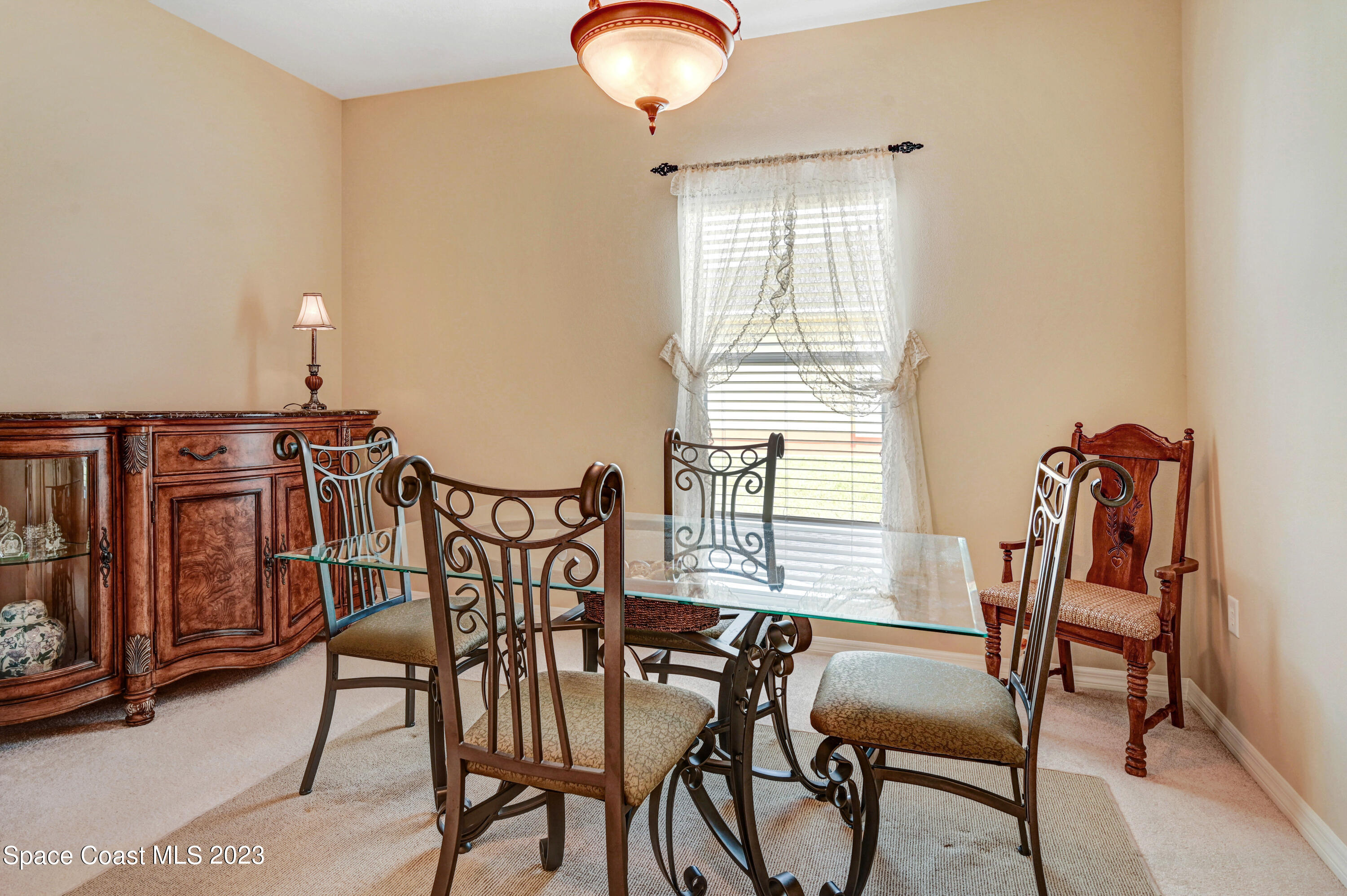 3341 Funston Circle Melbourne, FL 32940 - Photo 25 of 61 a view of a dining room with furniture and chandelier