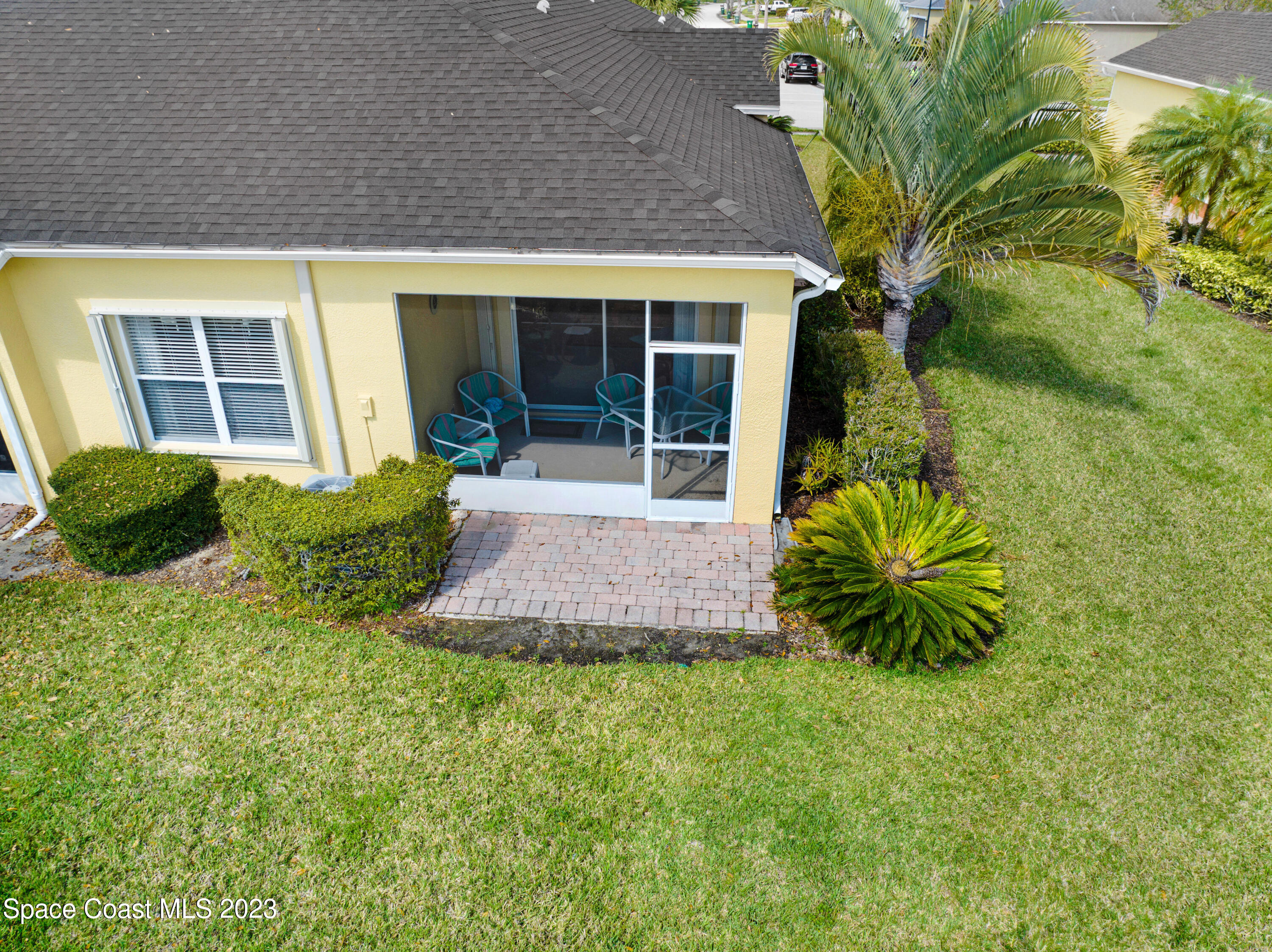 3341 Funston Circle Melbourne, FL 32940 - Photo 30 of 61 a front view of house and yard with green space