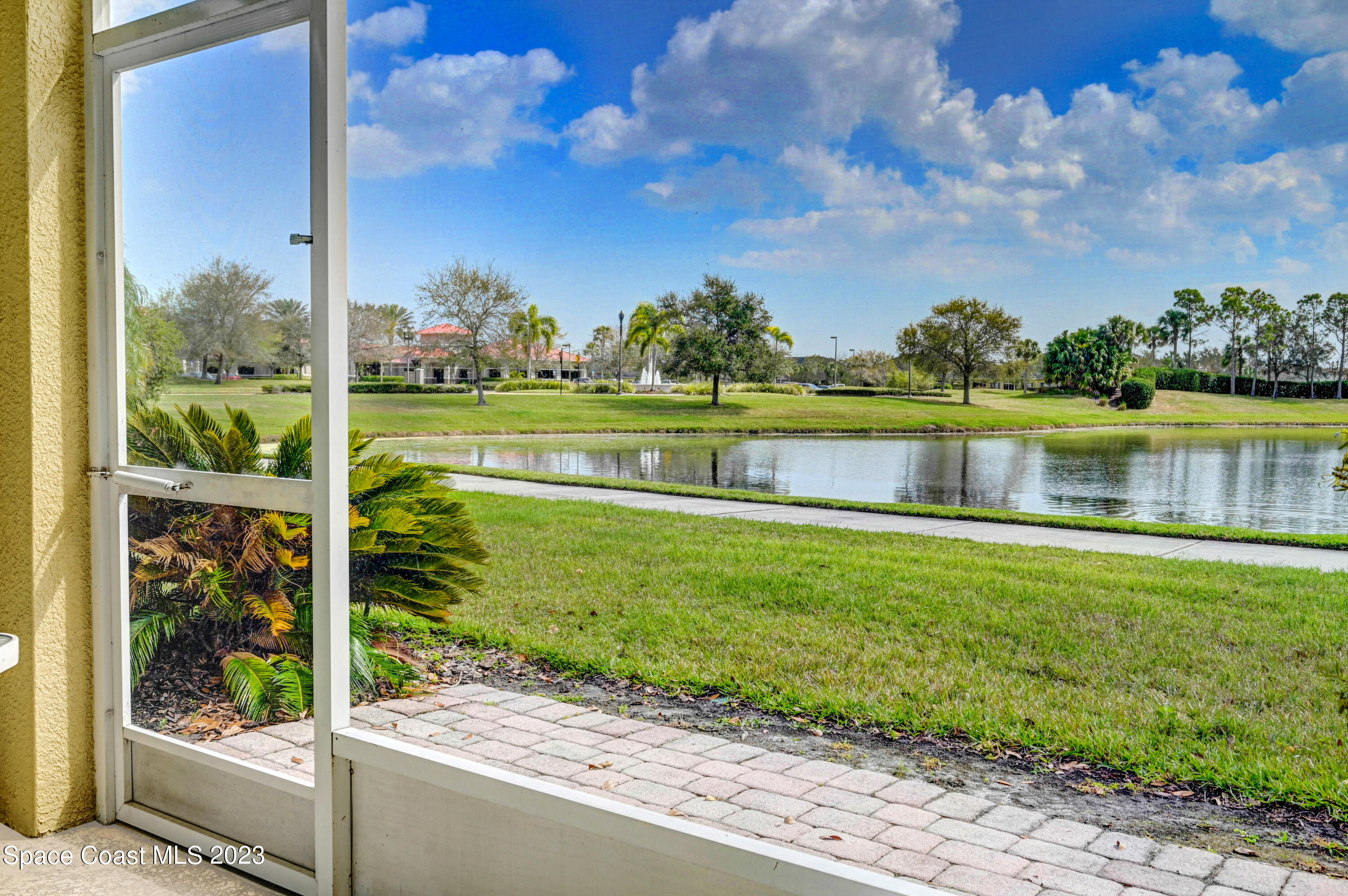 3341 Funston Circle Melbourne, FL 32940 - Photo 4 of 61 a view of a lake with houses in the back yard