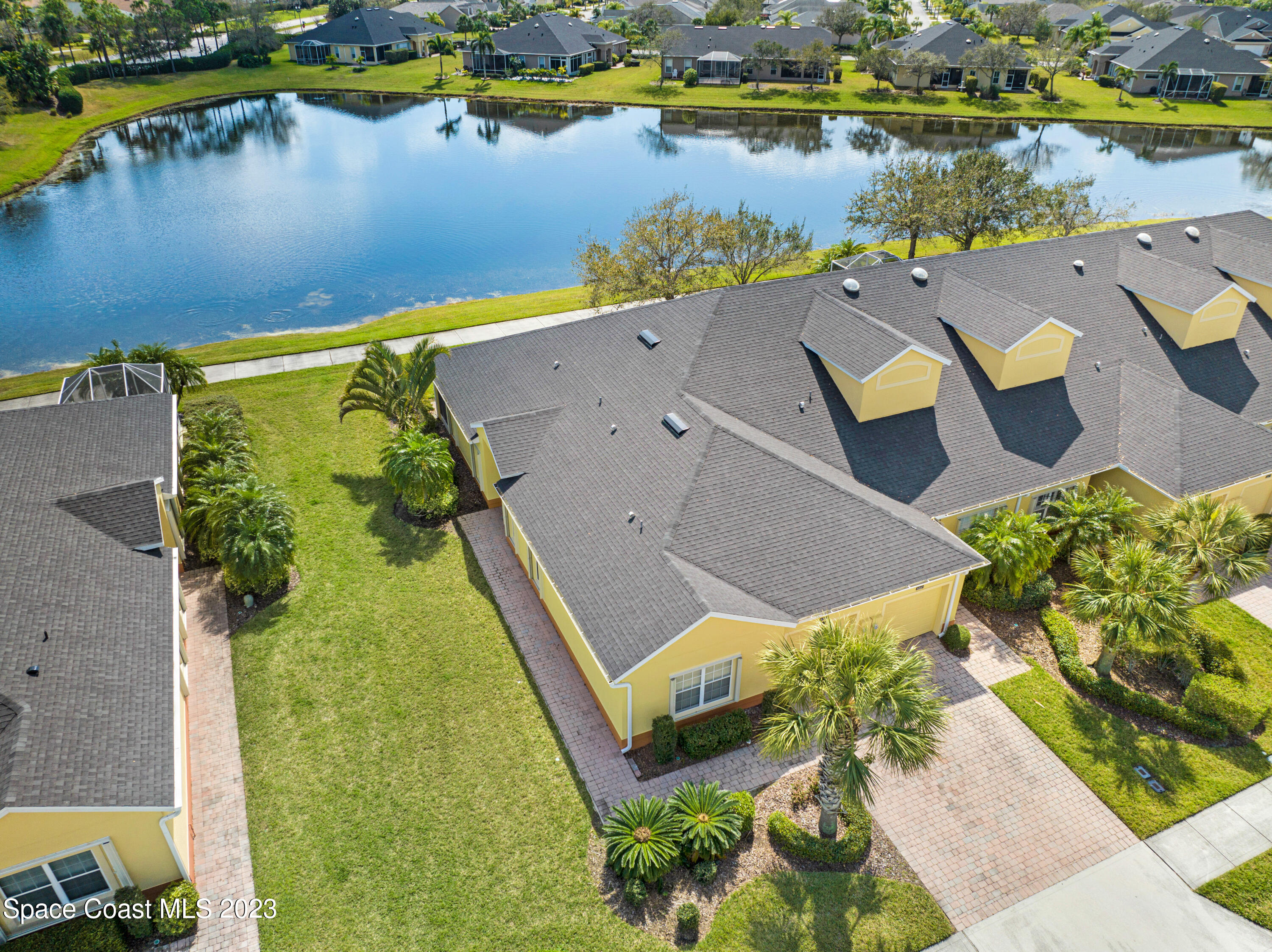 3341 Funston Circle Melbourne, FL 32940 - Photo 48 of 61 an aerial view of a house with a lake view