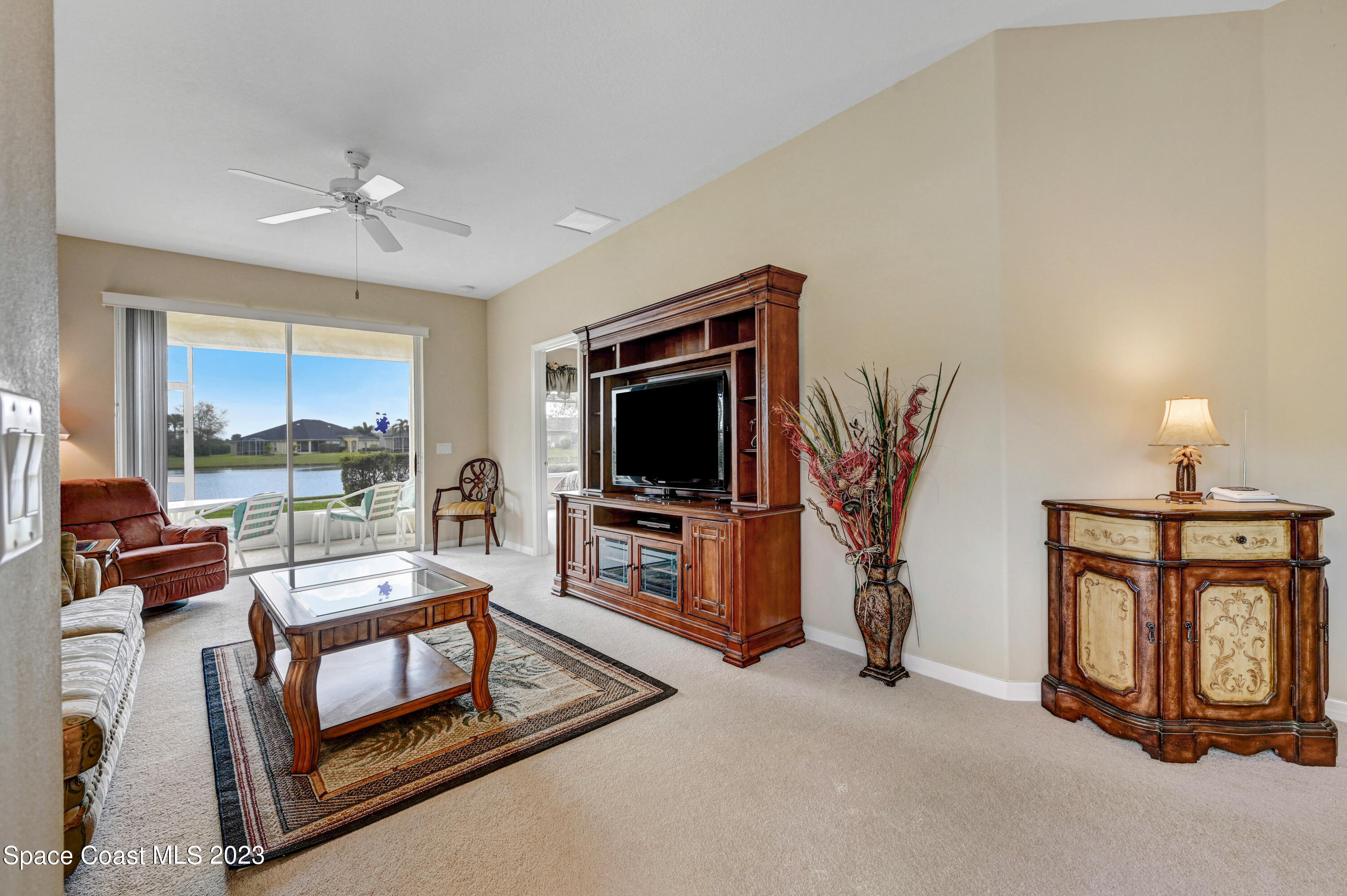 3341 Funston Circle Melbourne, FL 32940 - Photo 5 of 61 a living room with furniture and a flat screen tv