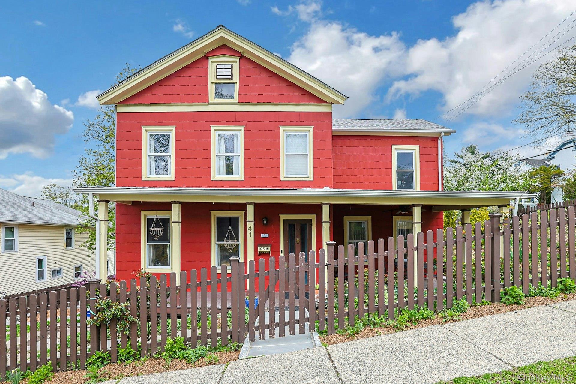 41 Clinton Avenue Ossining, NY 10562 - Photo 1 of 44 a front view of a house with a yard