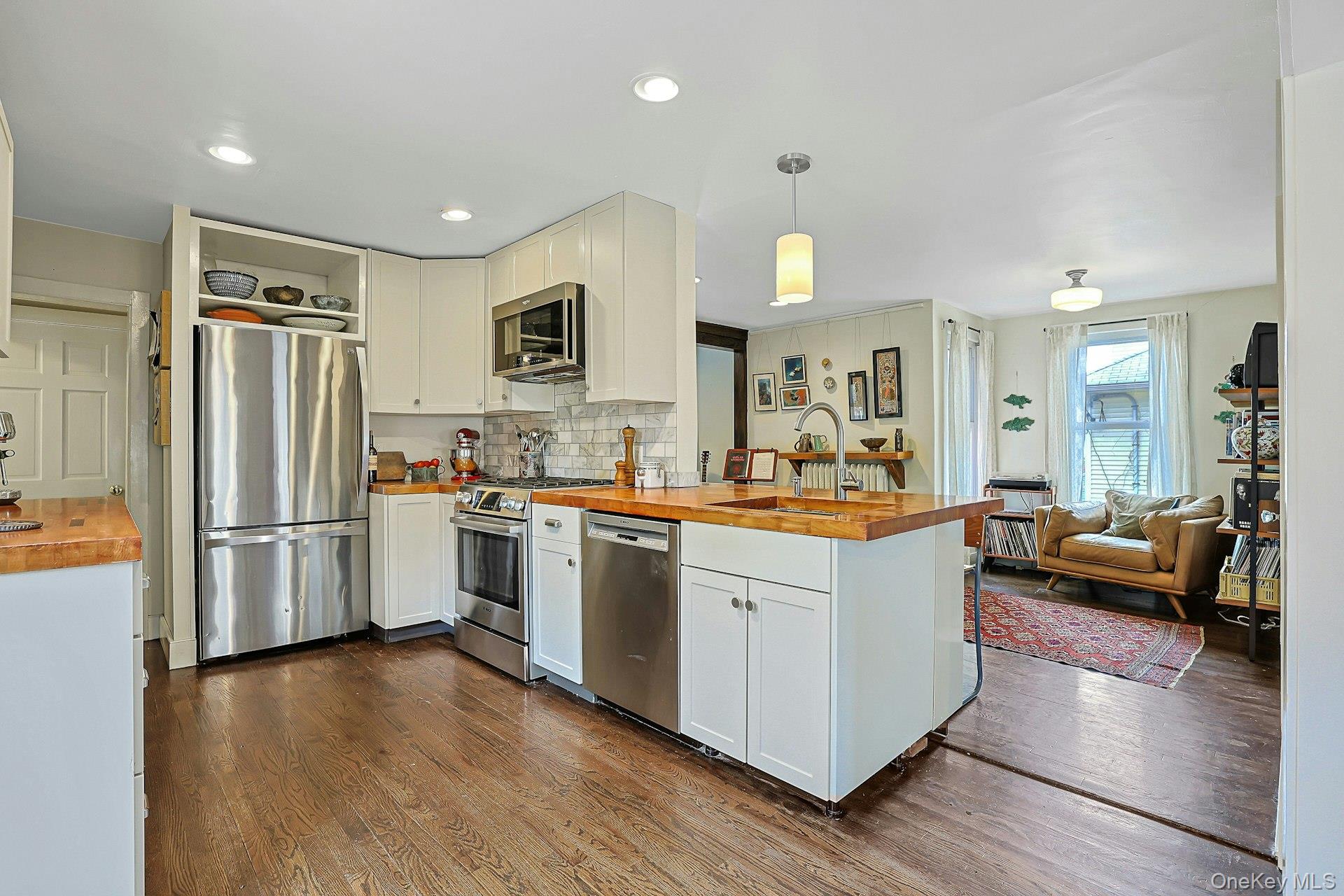 41 Clinton Avenue Ossining, NY 10562 - Photo 14 of 44 a large kitchen with a lot of counter space and wooden floor