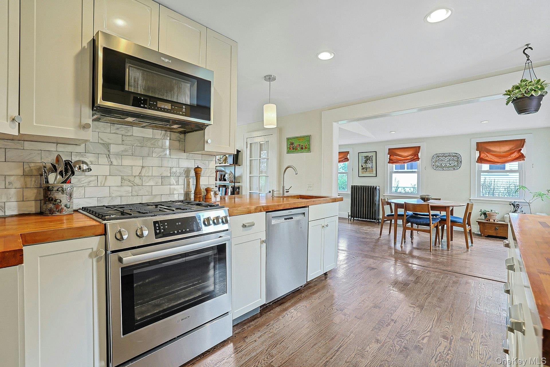 41 Clinton Avenue Ossining, NY 10562 - Photo 15 of 44 a kitchen with furniture wooden floor and stainless steel appliances