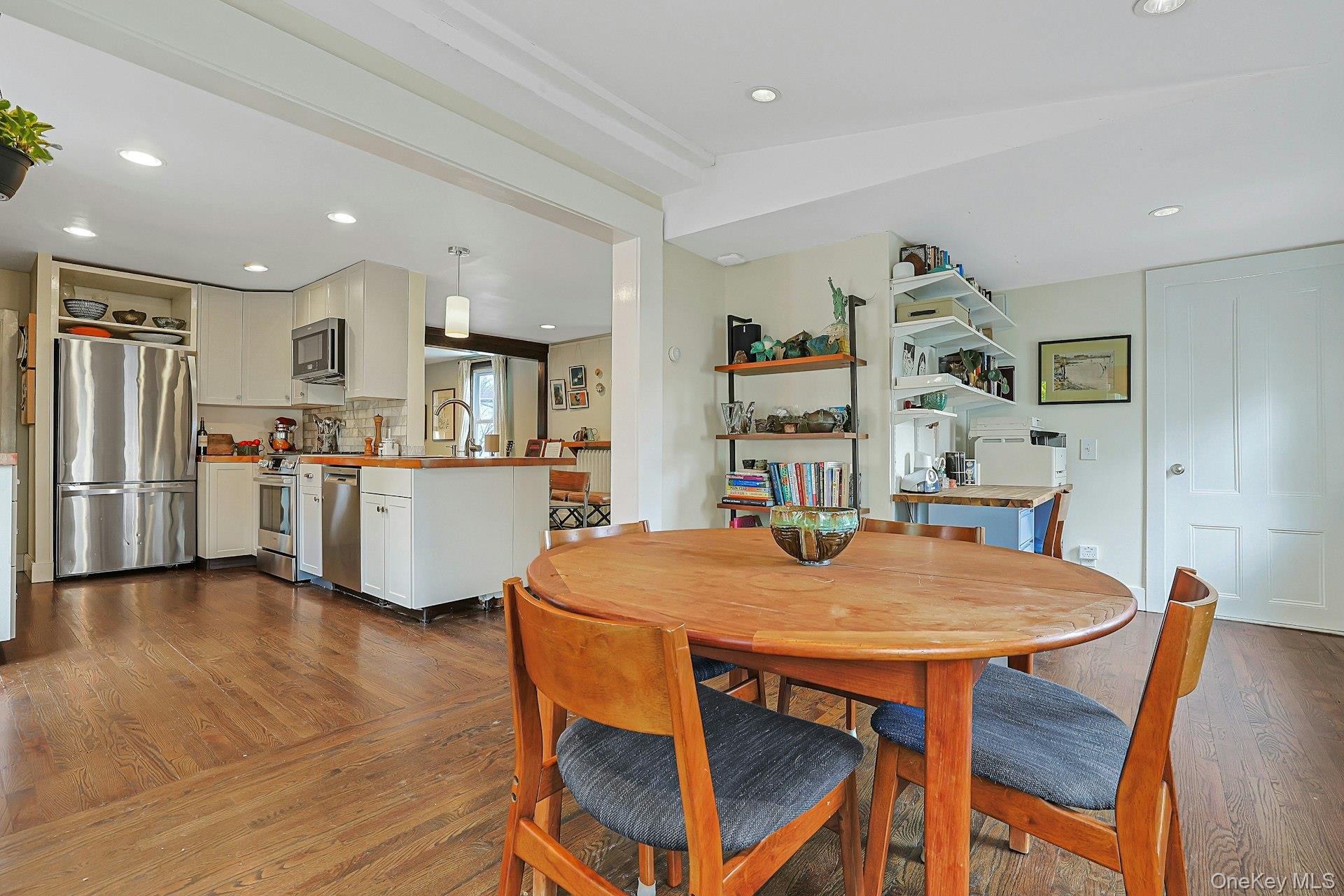41 Clinton Avenue Ossining, NY 10562 - Photo 17 of 44 a open kitchen with stainless steel appliances a table chairs and refrigerator