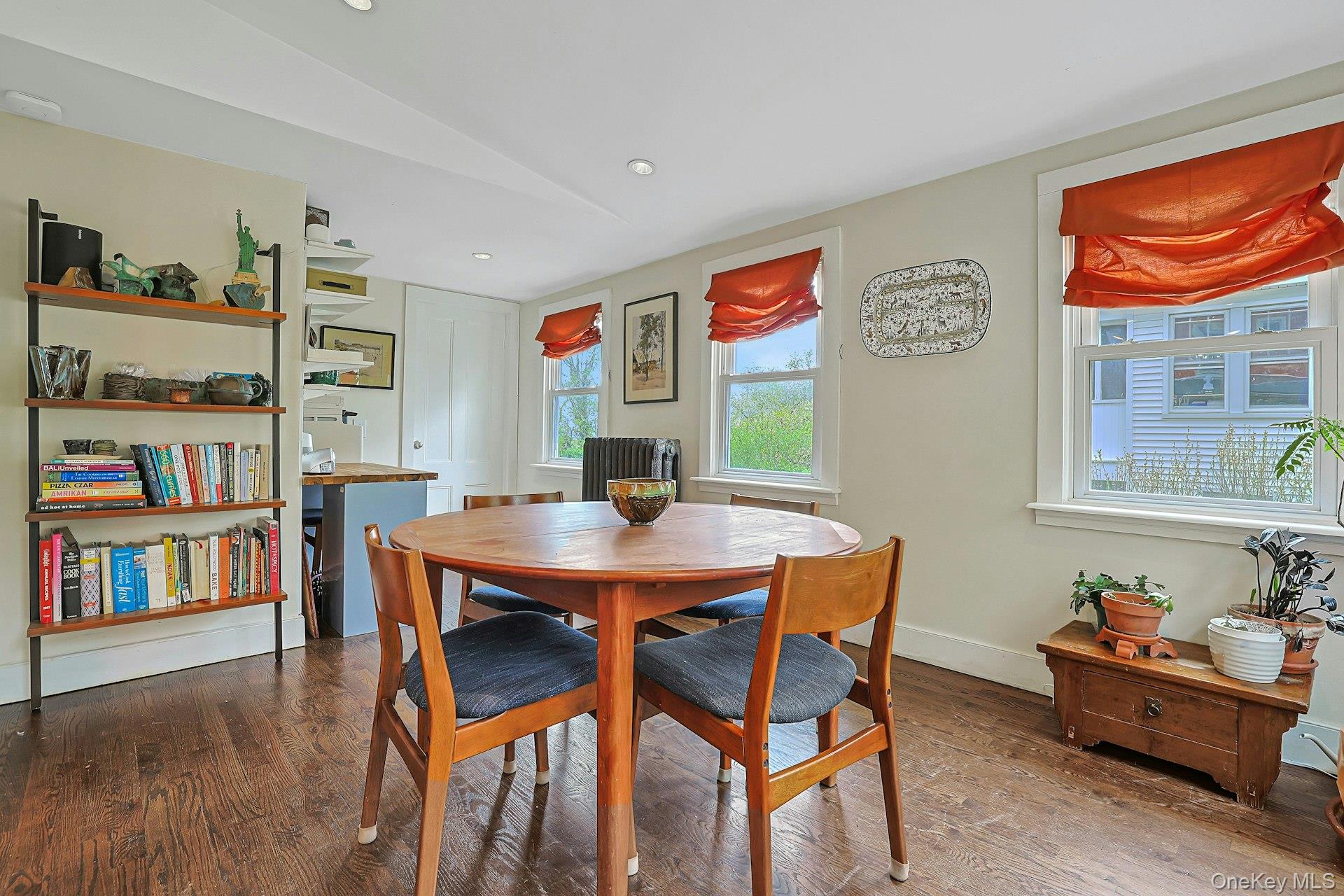 41 Clinton Avenue Ossining, NY 10562 - Photo 20 of 44 a view of a dining room with furniture and a book shelf