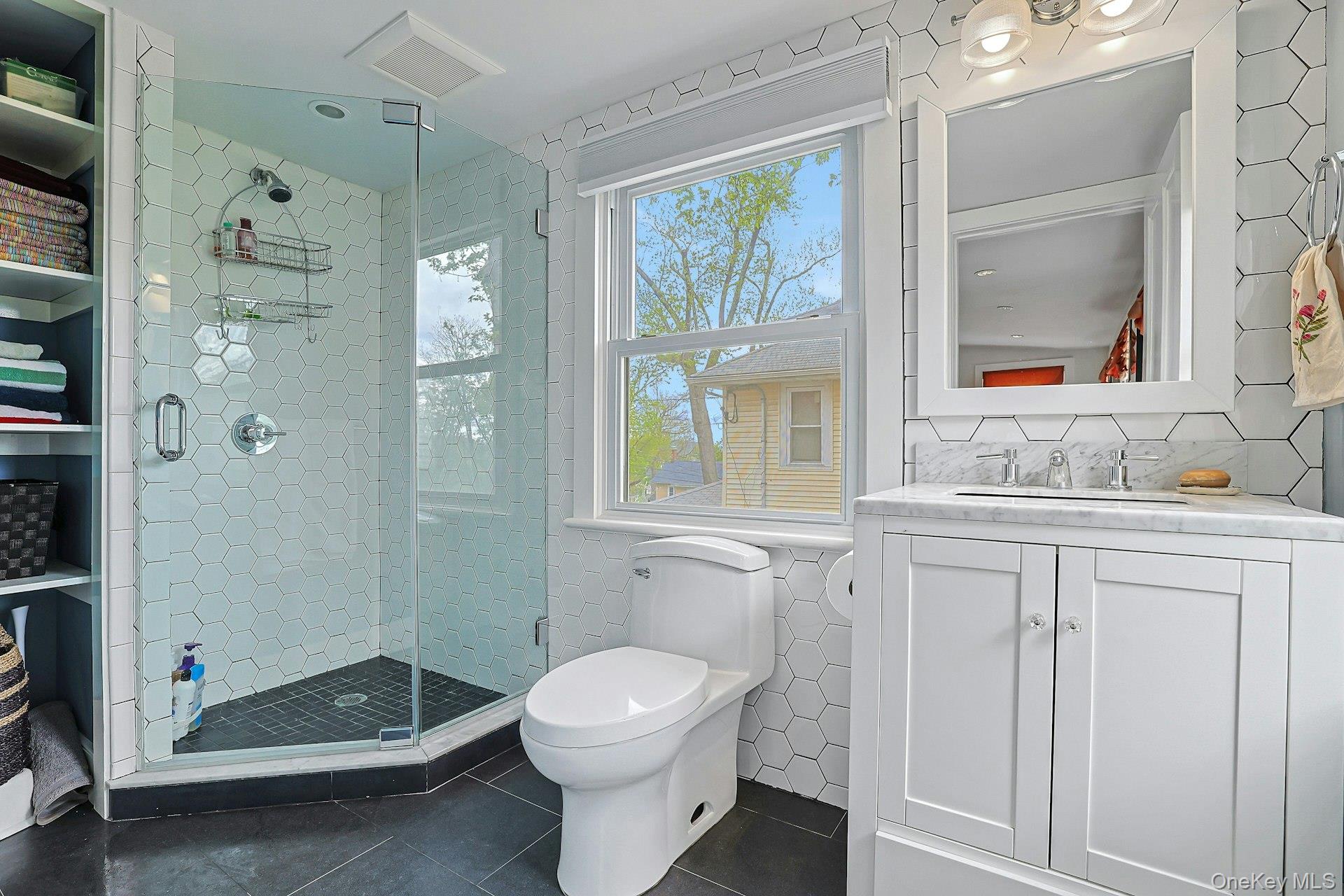 41 Clinton Avenue Ossining, NY 10562 - Photo 21 of 44 a bathroom with a sink vanity granite toilet and shower