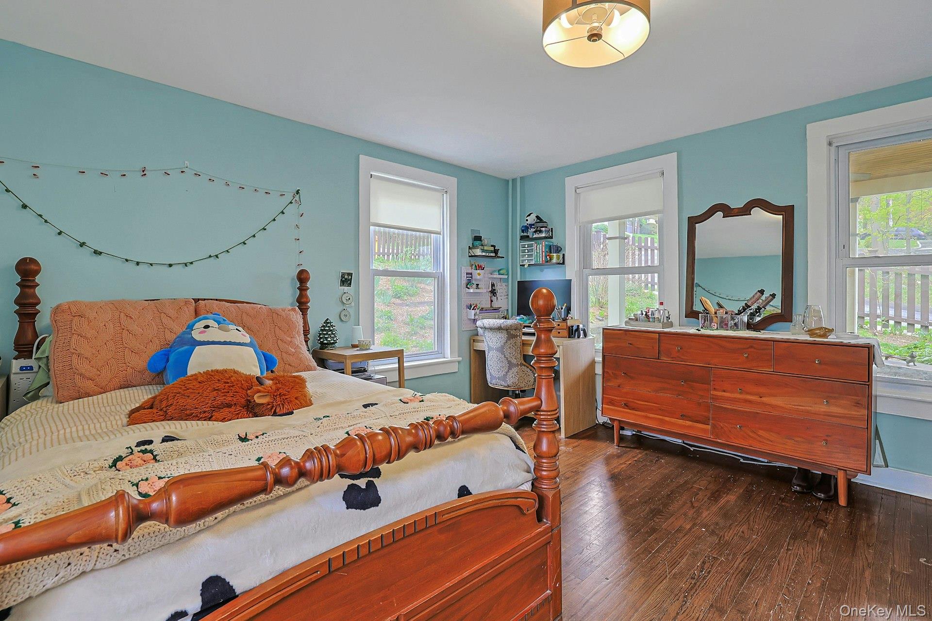 41 Clinton Avenue Ossining, NY 10562 - Photo 22 of 44 a bedroom with a bed and wooden floor