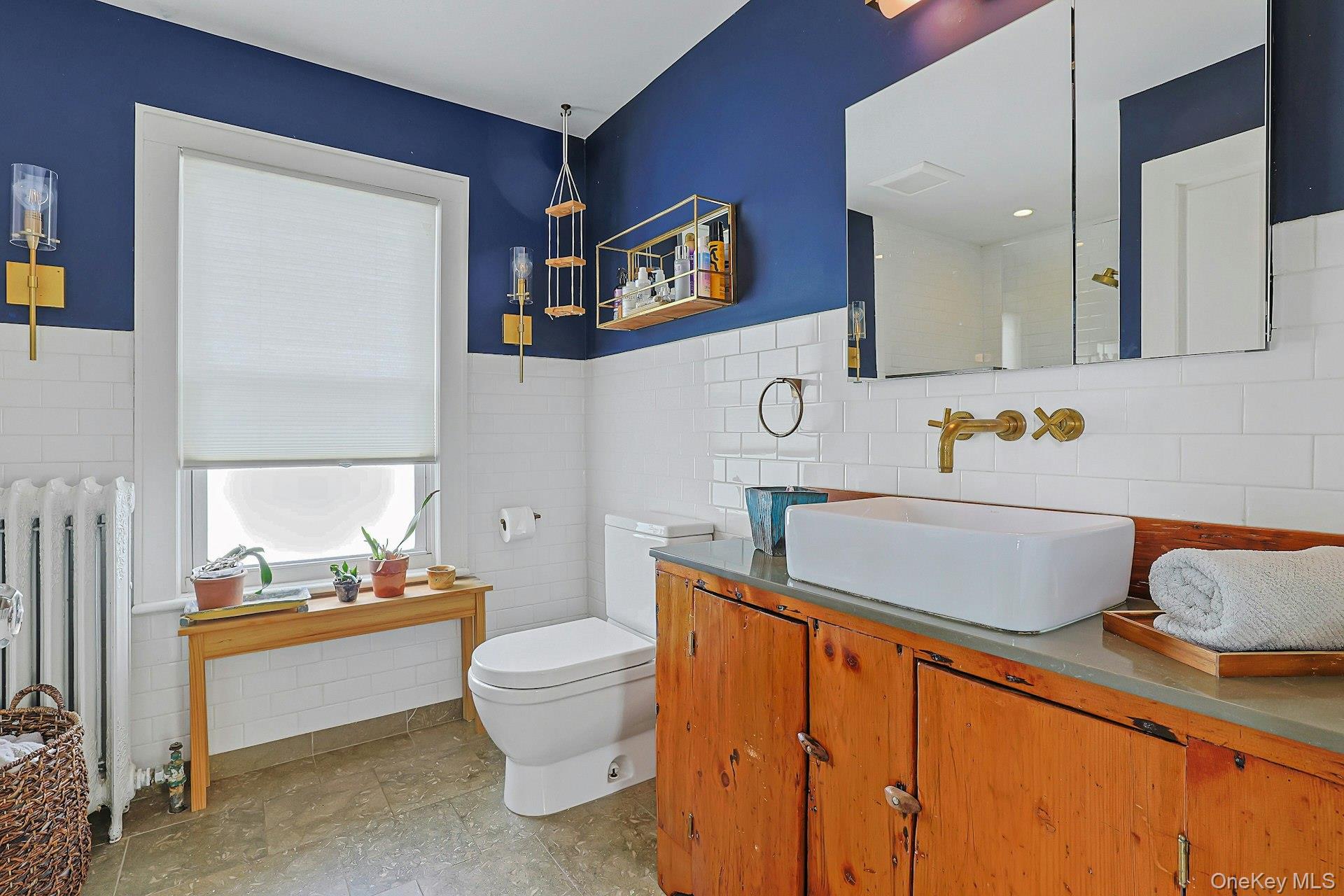 41 Clinton Avenue Ossining, NY 10562 - Photo 25 of 44 a bathroom with a sink toilet and mirror