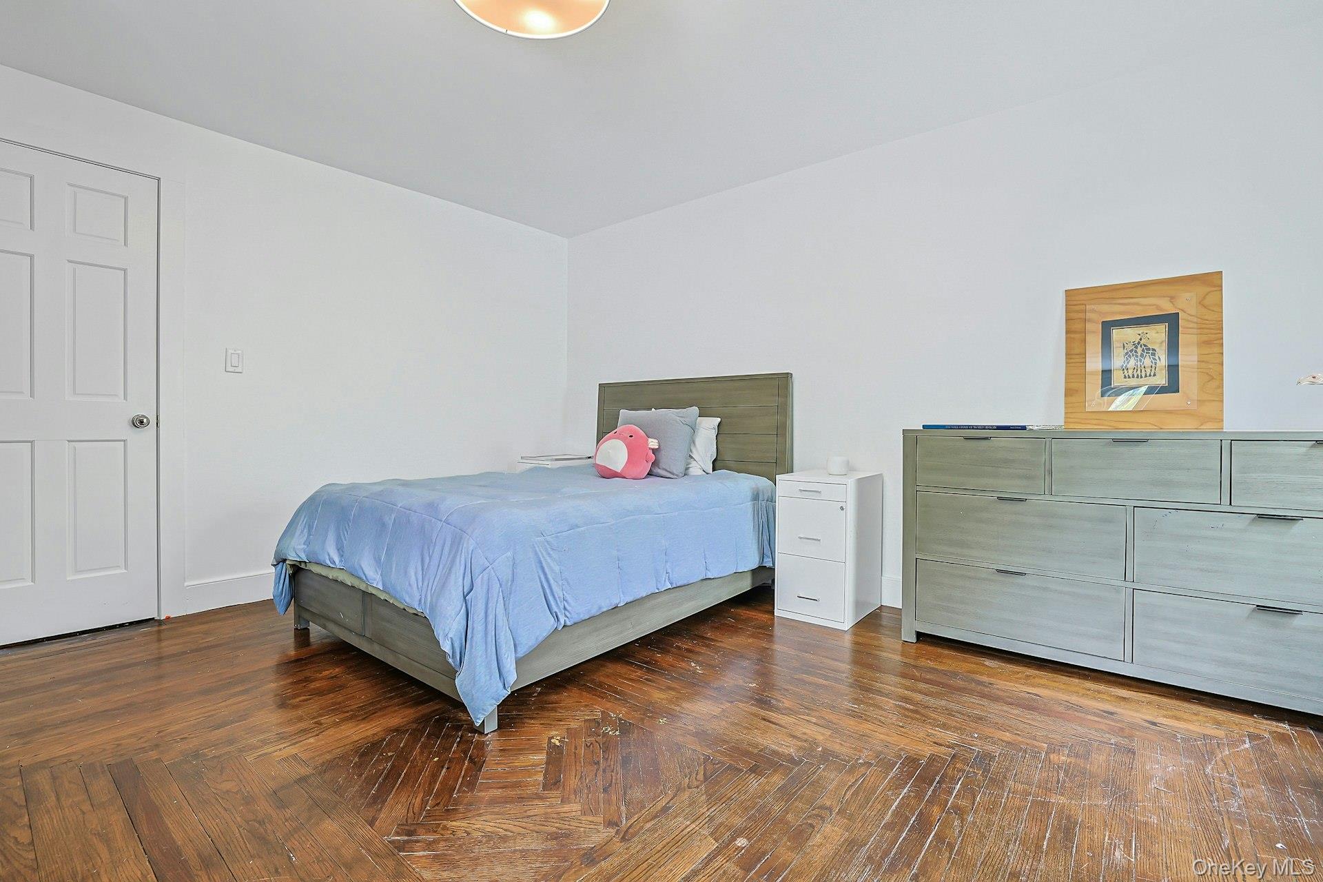 41 Clinton Avenue Ossining, NY 10562 - Photo 28 of 44 a spacious bedroom with a bed and cabinet