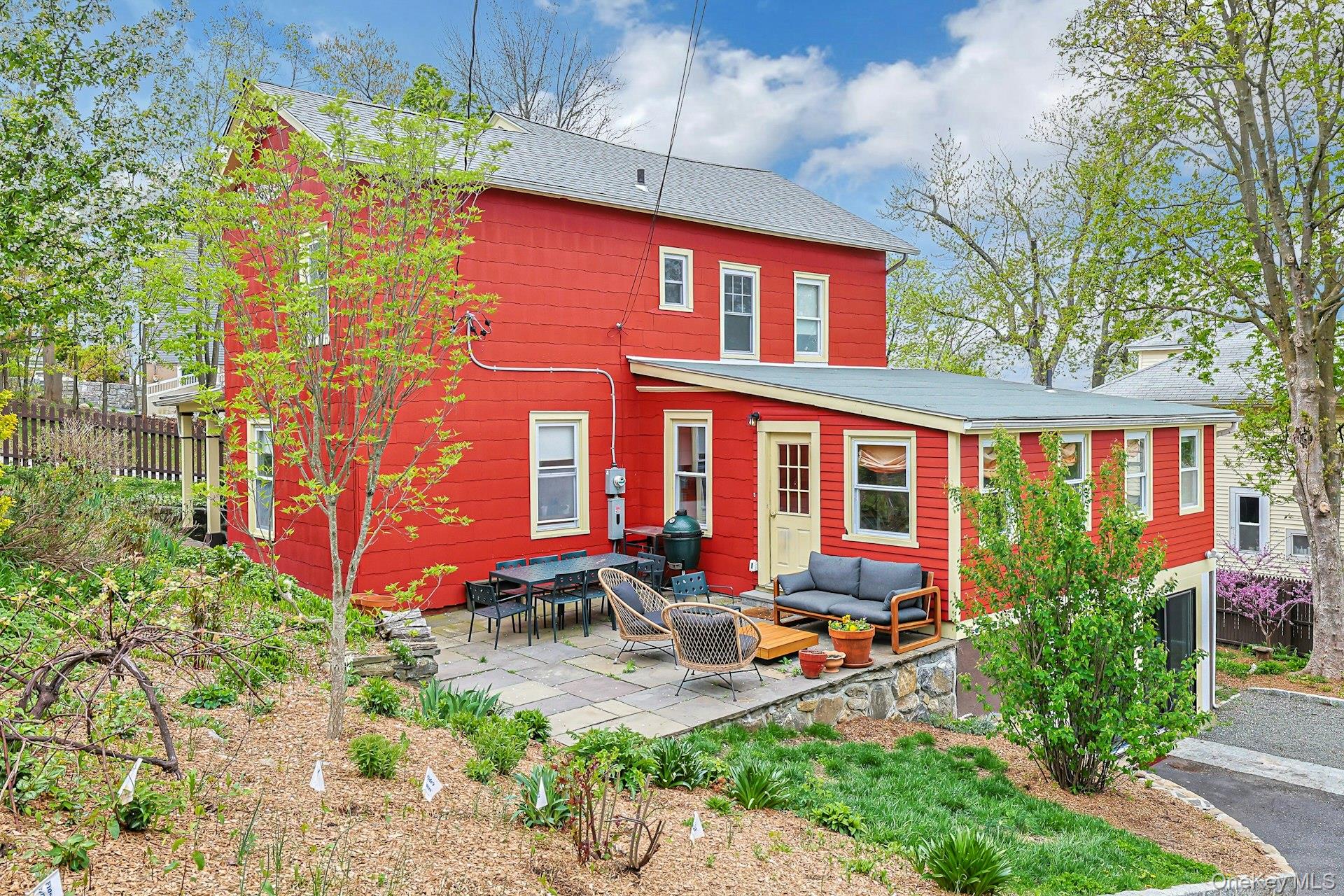41 Clinton Avenue Ossining, NY 10562 - Photo 33 of 44 a front view of a house with patio and garden