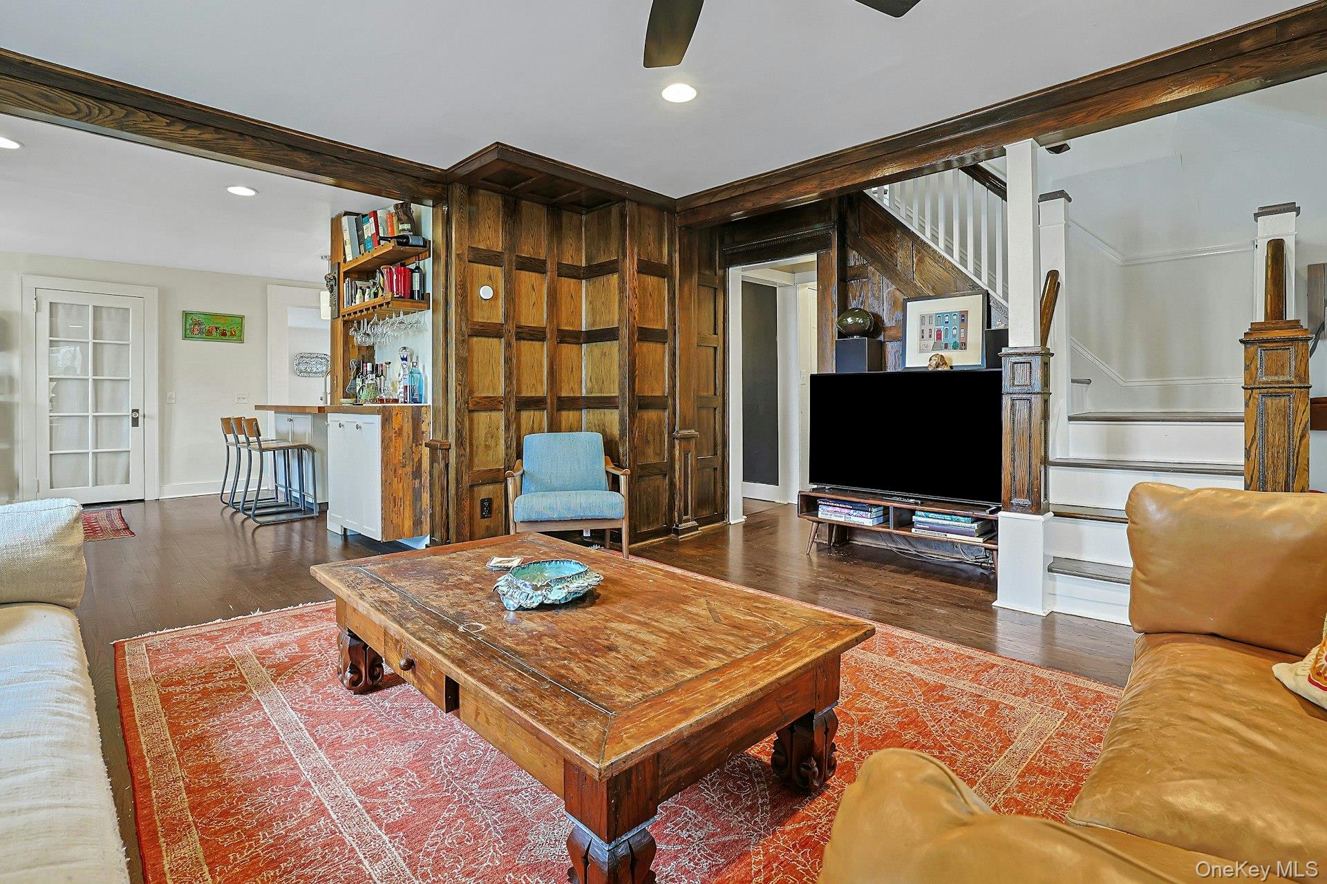 41 Clinton Avenue Ossining, NY 10562 - Photo 10 of 44 a living room with furniture a flat screen tv and a large window