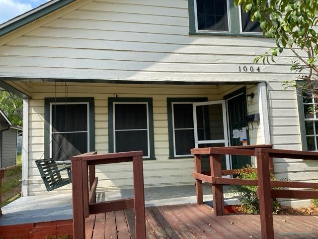 1004 Mccall Avenue Conroe, TX 77301 - Photo 3 of 14 a front view of a house with a porch