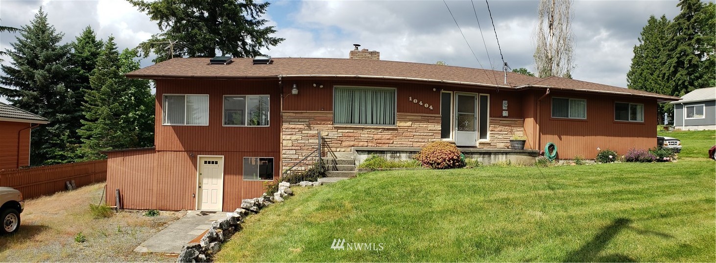10404 Southeast 166th Street Renton, WA 98055 - Photo 1 of 29 a front view of a house with yard and garage