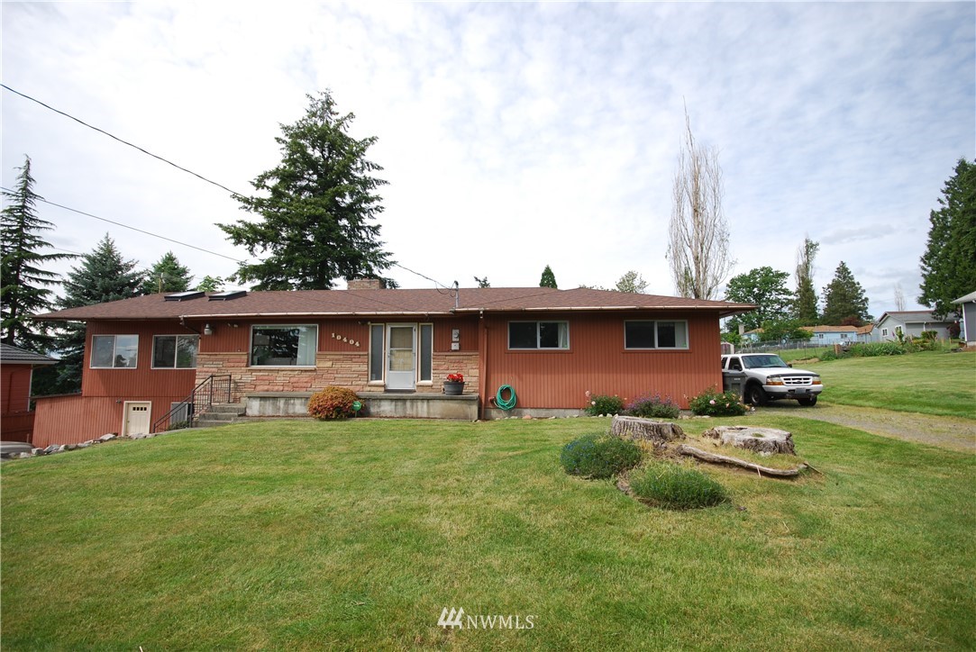 10404 Southeast 166th Street Renton, WA 98055 - Photo 2 of 29 a view of a house with a yard and sitting area