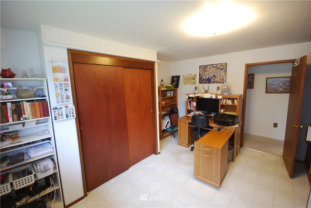 10404 Southeast 166th Street Renton, WA 98055 - Photo 22 of 29 a view of a livingroom with workspace and a couch