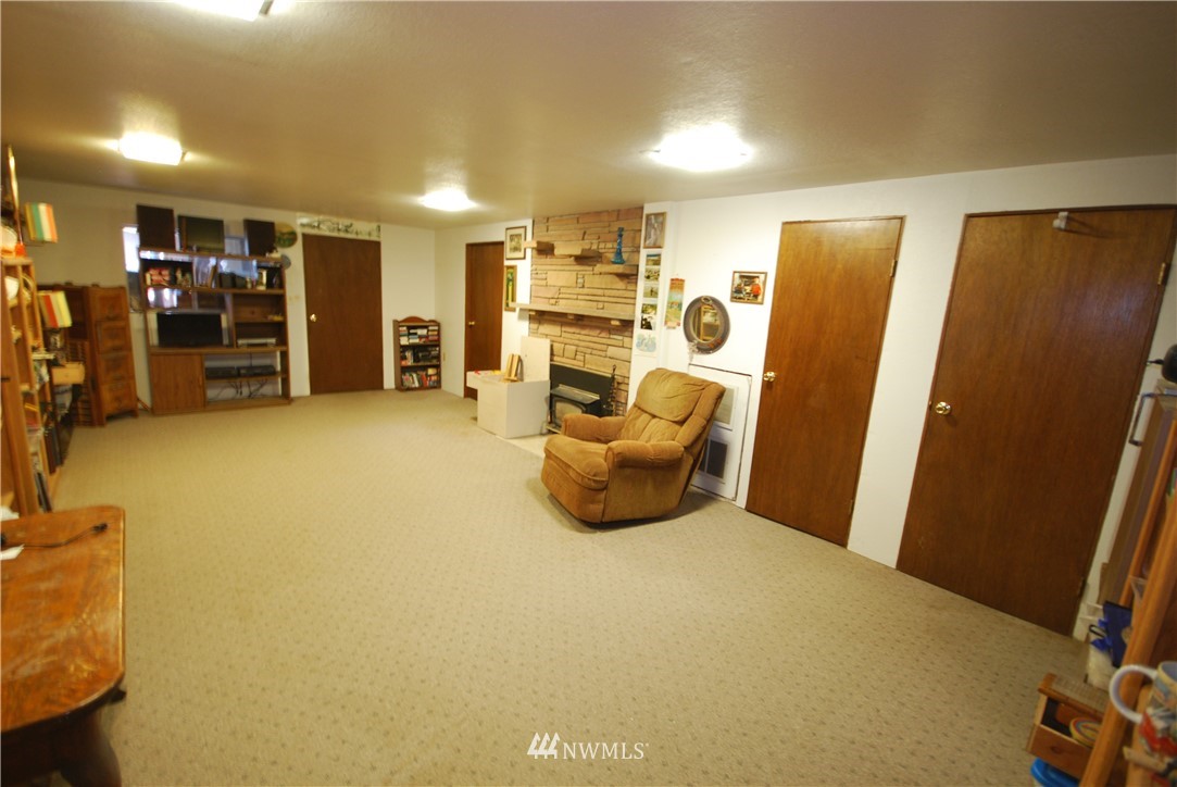 10404 Southeast 166th Street Renton, WA 98055 - Photo 25 of 29 a view of a room with furniture and storage