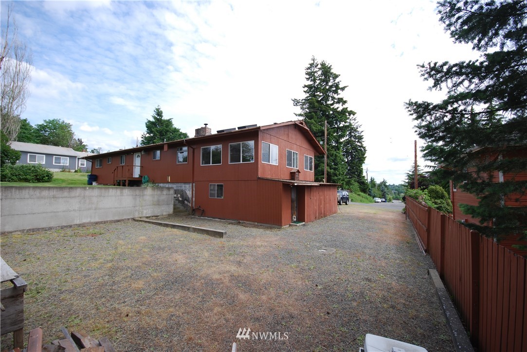 10404 Southeast 166th Street Renton, WA 98055 - Photo 4 of 29 a view of a house with a yard